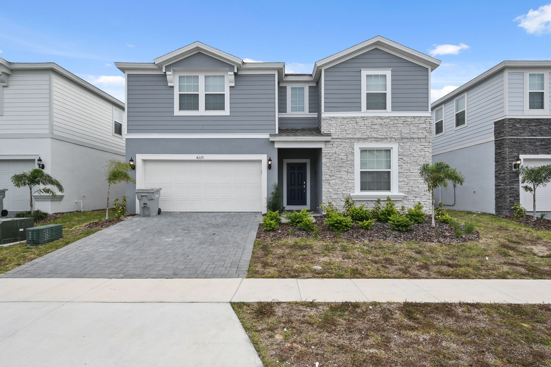 Modern 9-bedroom resort home with game rooms, theater, and private pool retreat.
