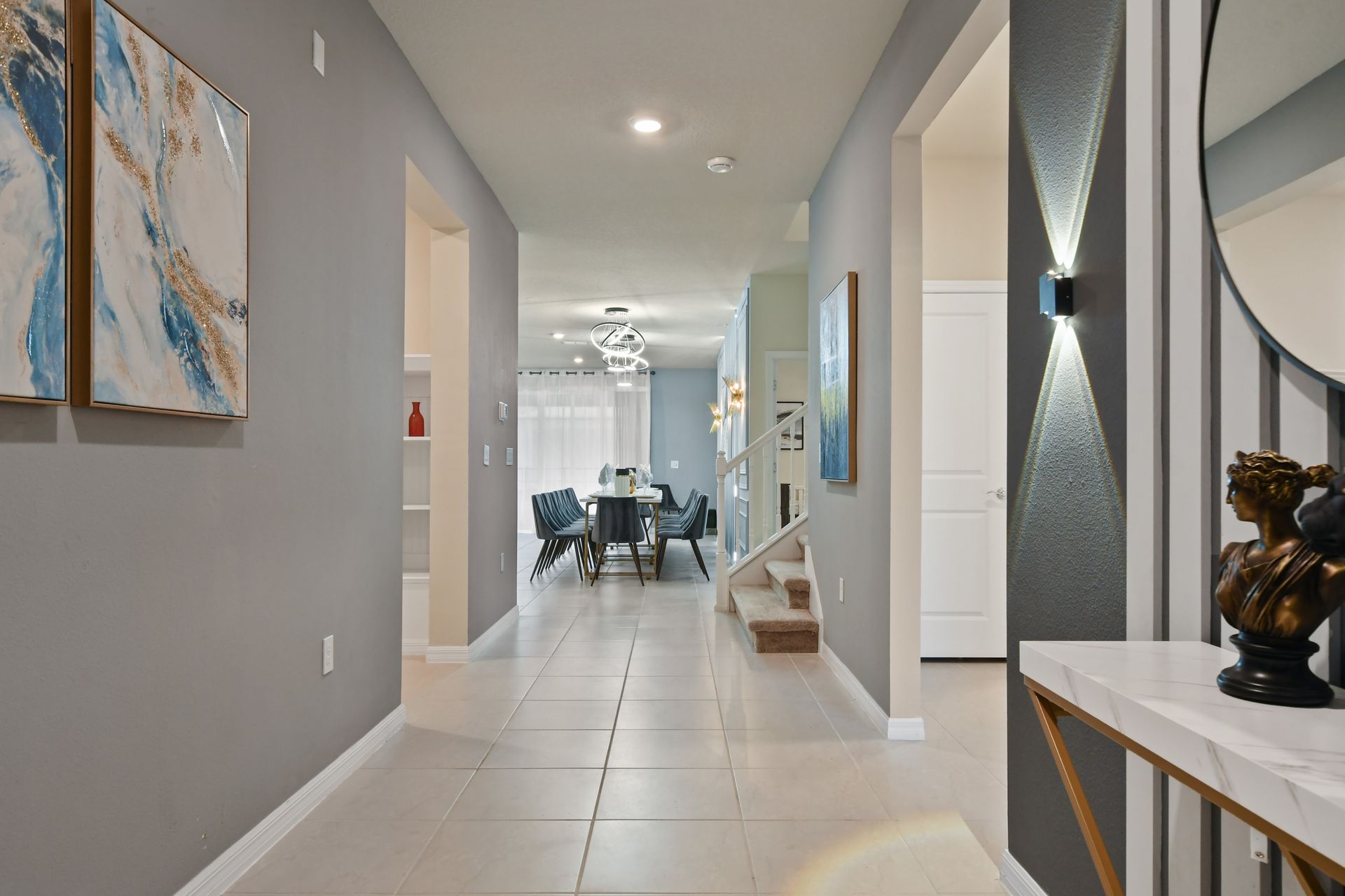 Spacious ensuite with double vanity, soaking tub, and direct poolside access.
