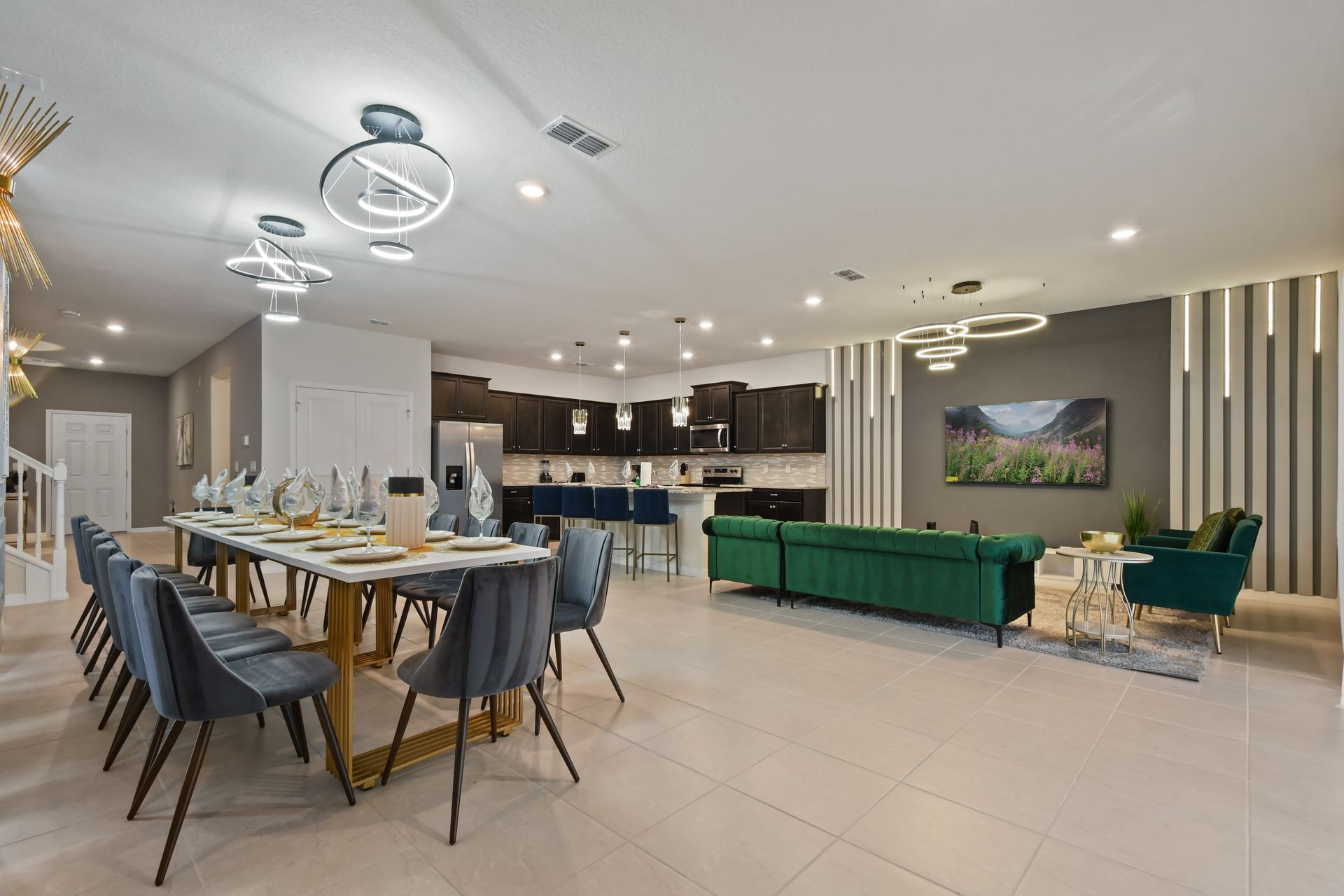 Stunning open-concept home with designer lighting, luxe seating, and full kitchen.
