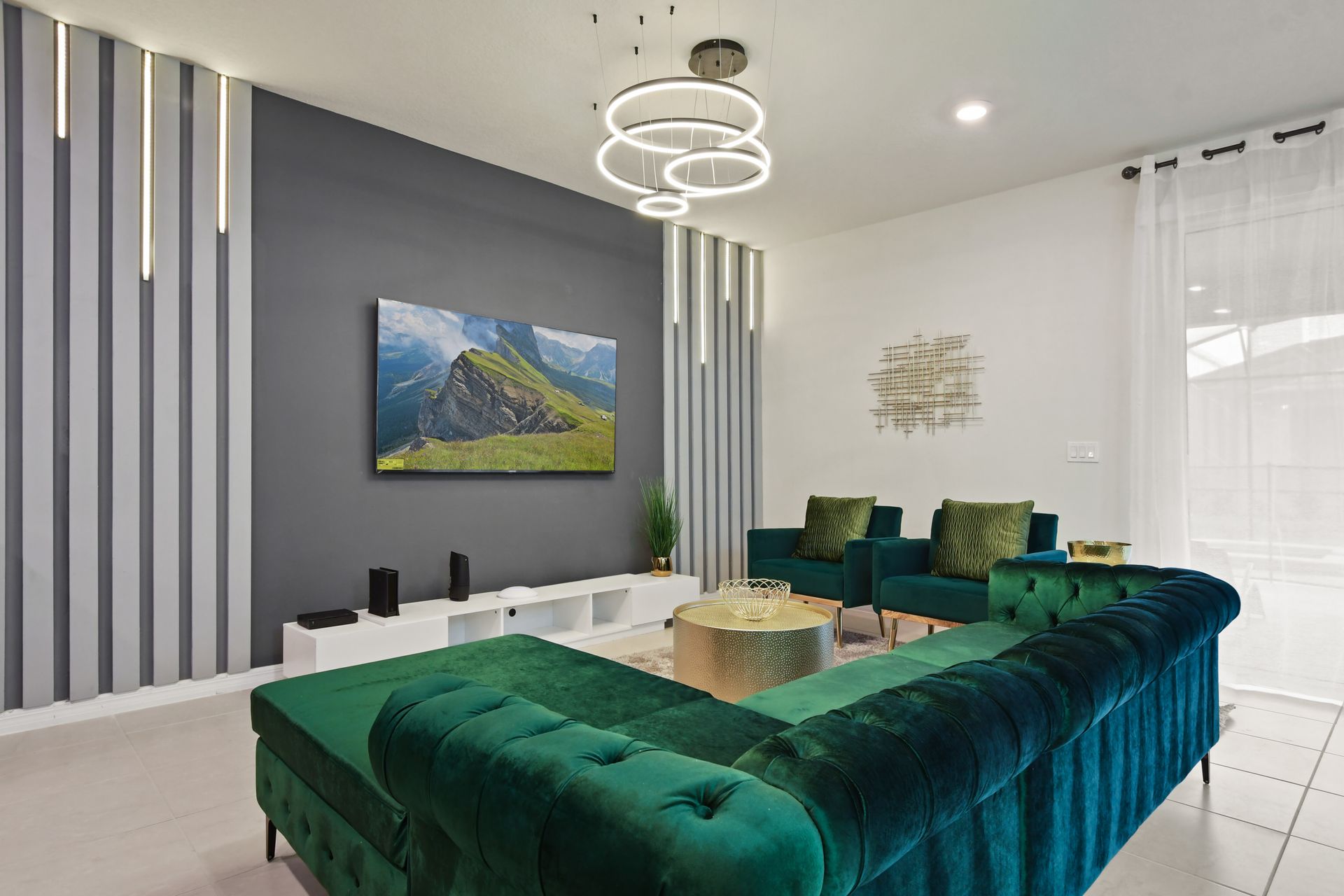 Stylish lounge with emerald velvet seating, modern lighting, and cozy vibes.
