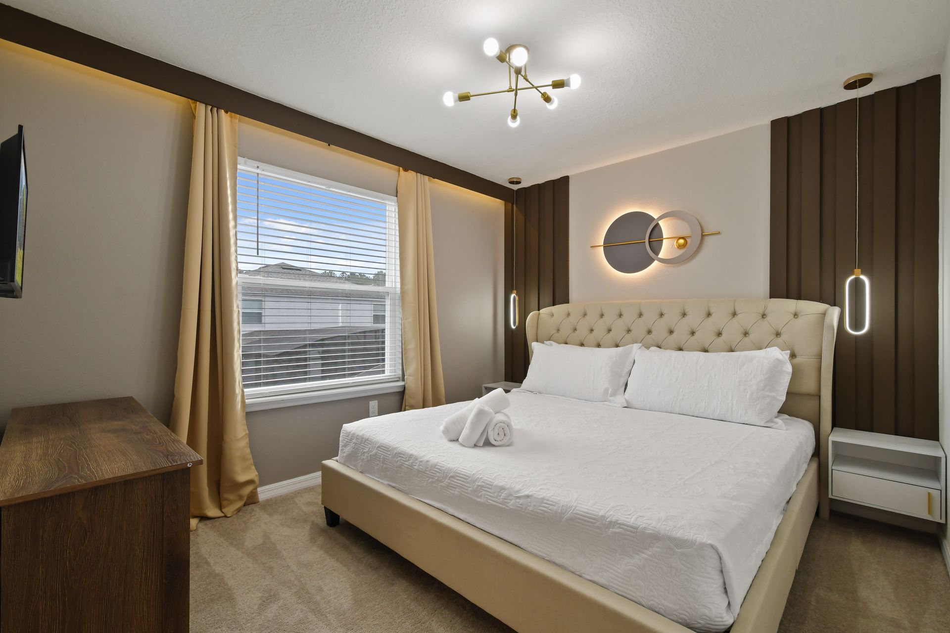 Serene modern bedroom with plush king bed, soft lighting, and elegant decor.
