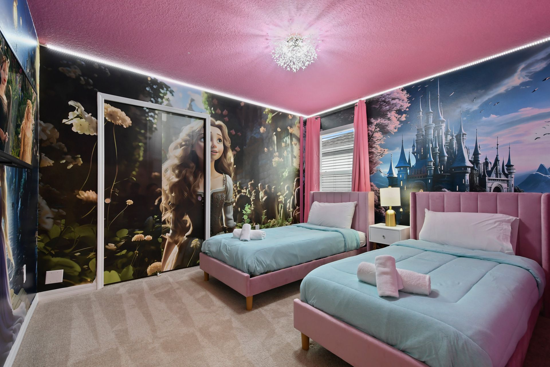 Whimsical princess room with castle mural, twin beds, and magical pink charm.
