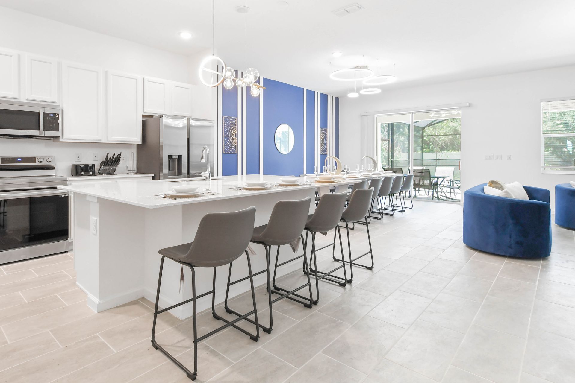 Spacious modern kitchen with a large island, sleek décor, and open-concept design.