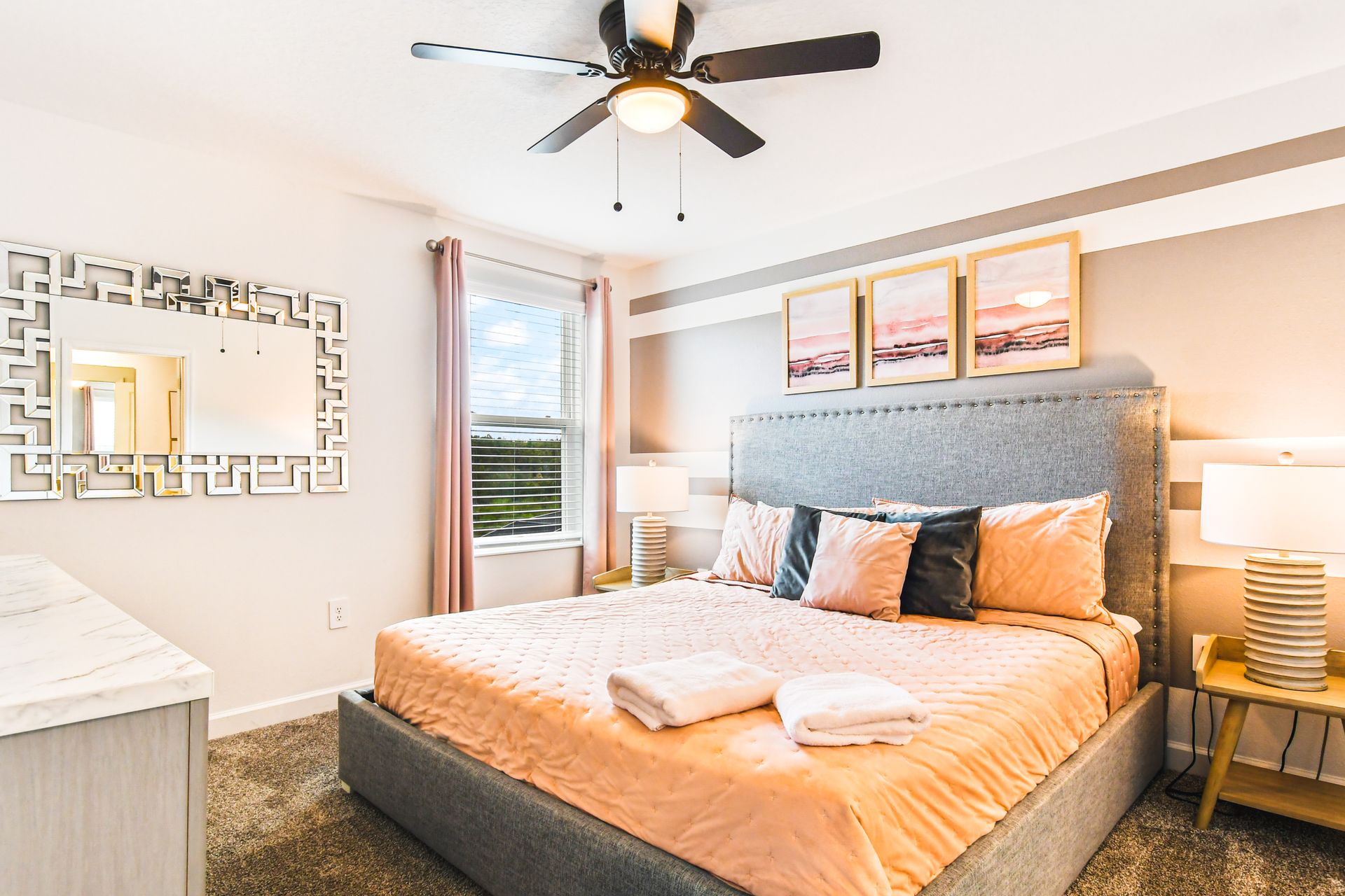 Charming and modern bedroom featuring a tufted upholstered bed.