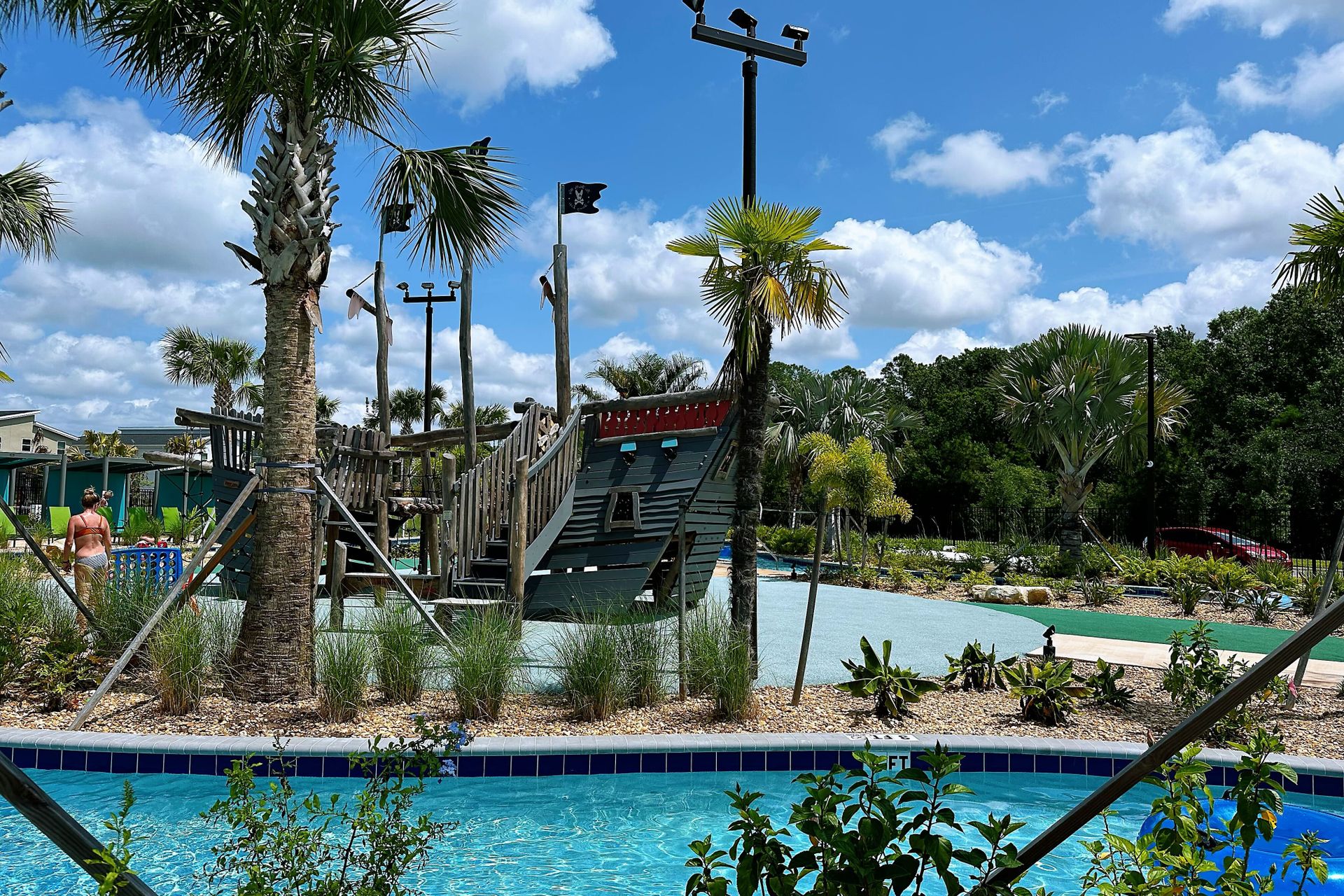 Resort Amenities - Indulge in ultimate relaxation as you float in the sun-kissed waters of the resort lazy pool, offering a serene retreat just steps from your door.