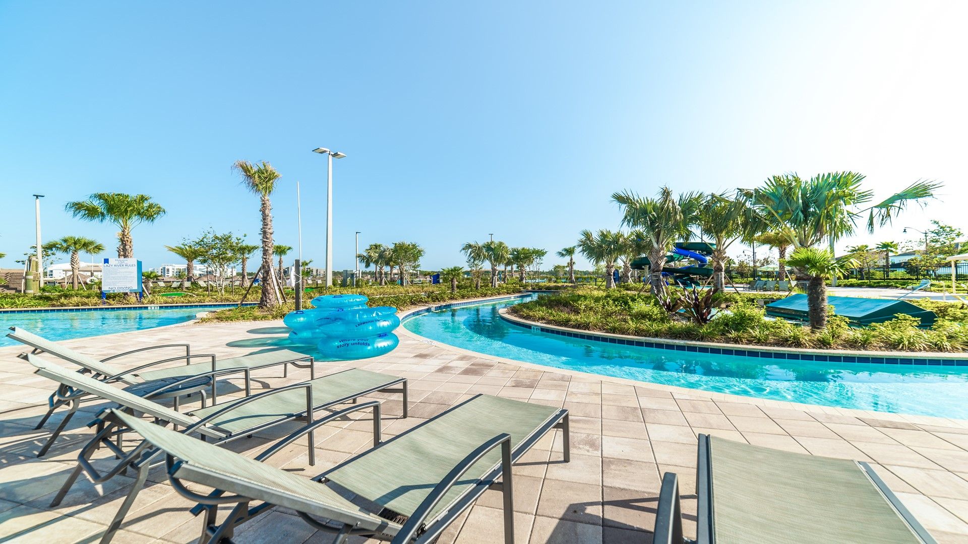 Resort Amenities - Soak up the sun in comfort on our poolside chairs, offering you a relaxing spot to unwind and enjoy the poolside ambiance.