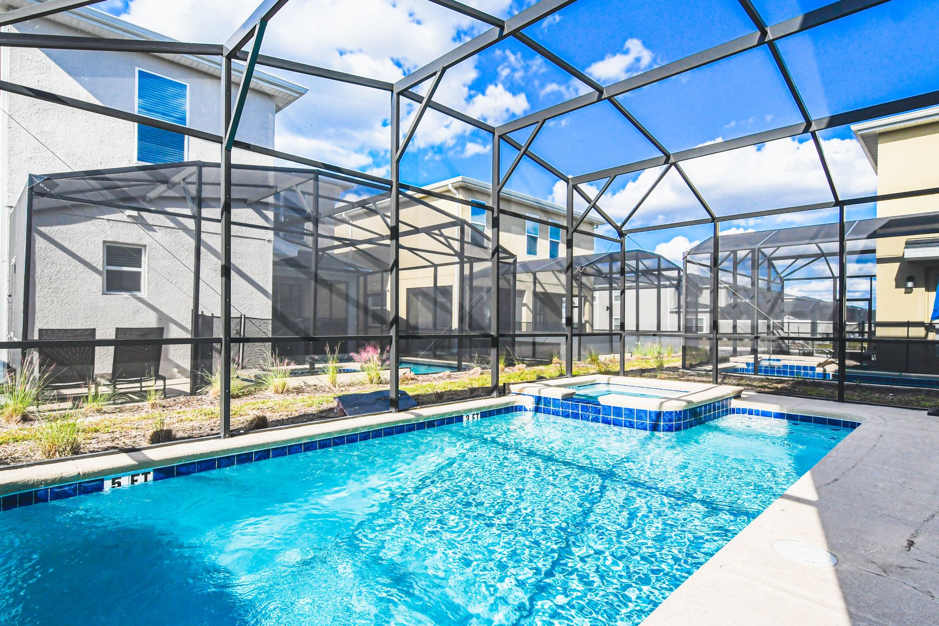 Private screened pool and spa with sunny patio—perfect for relaxing or playtime