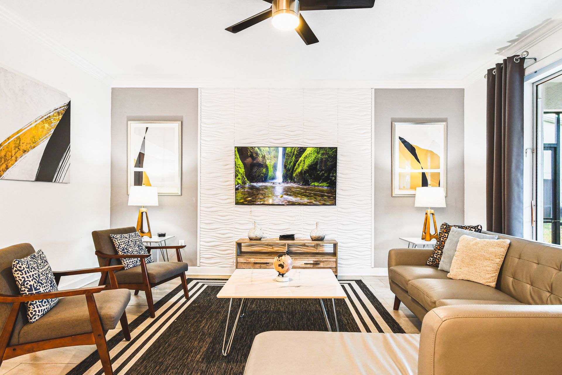 Cozy modern living room with smart TV, sleek decor, and natural light views