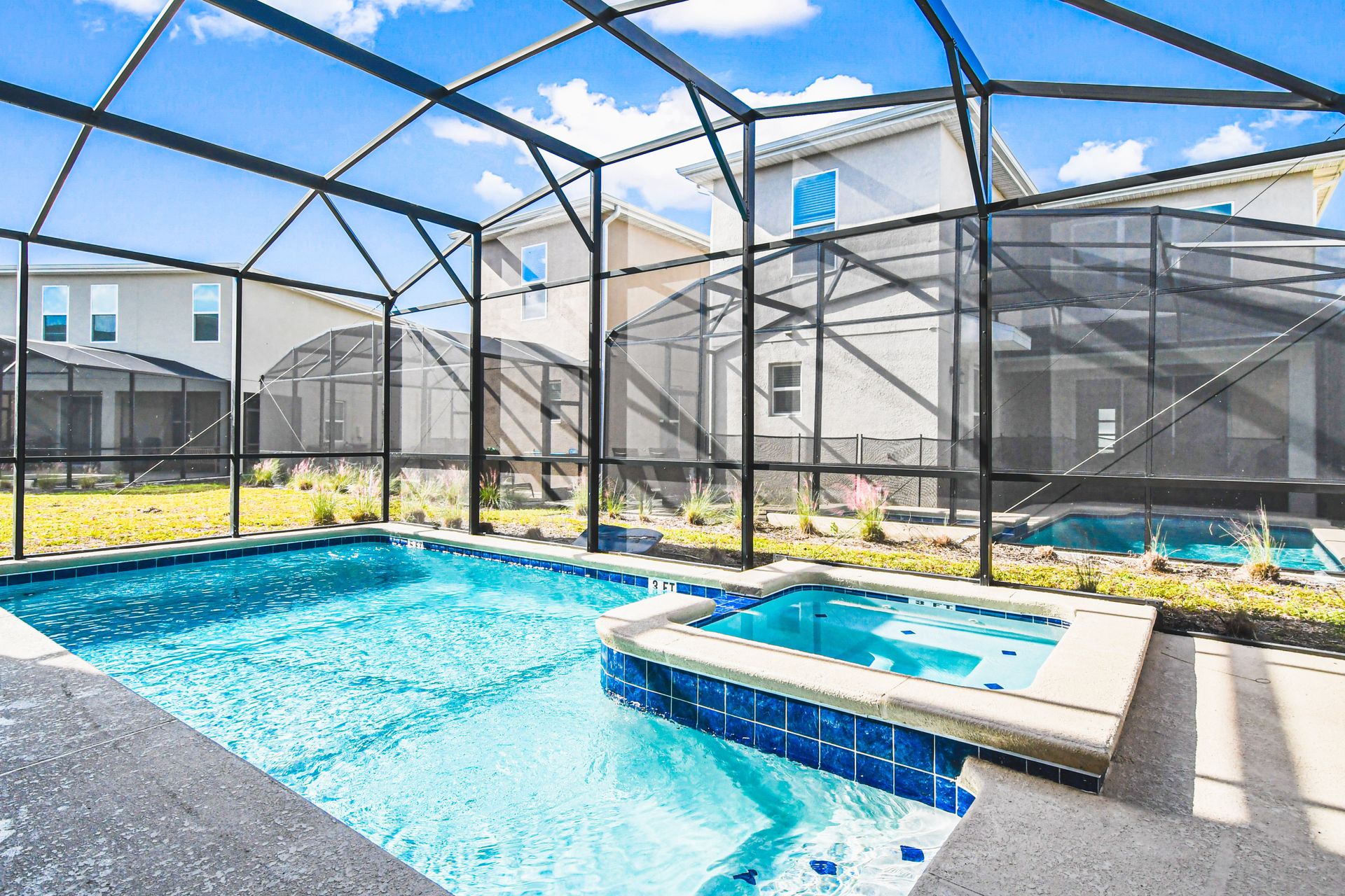 Private screened pool and spa with sunny patio—perfect for relaxing or playtime