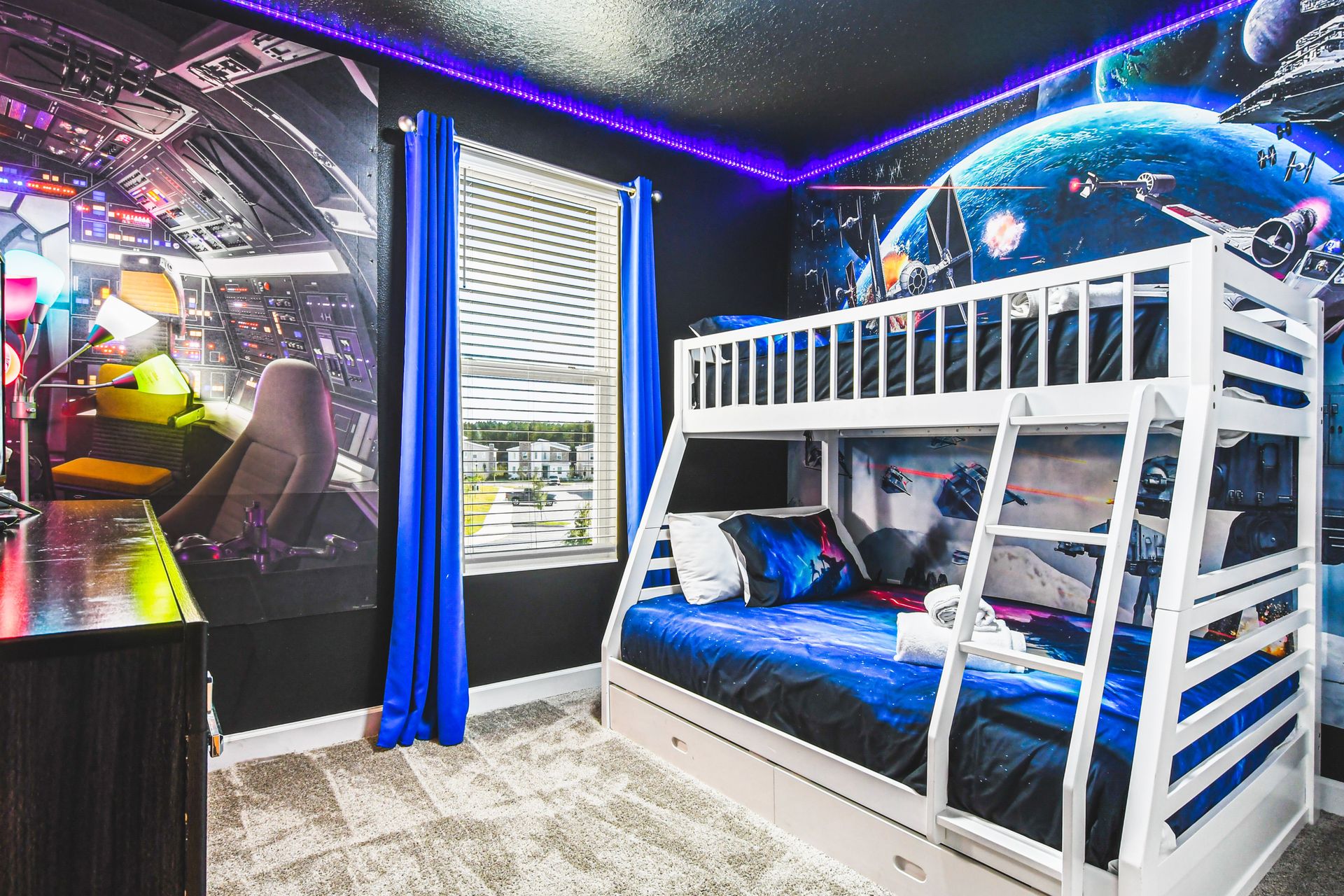 Epic galaxy-themed bunk room with LED lights, perfect for young space adventurers