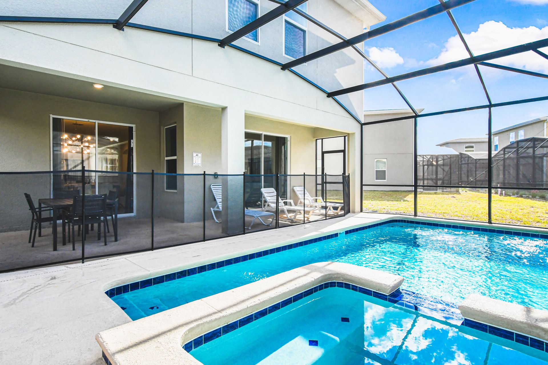 Private screened pool and spa with sunny patio—perfect for relaxing or playtime