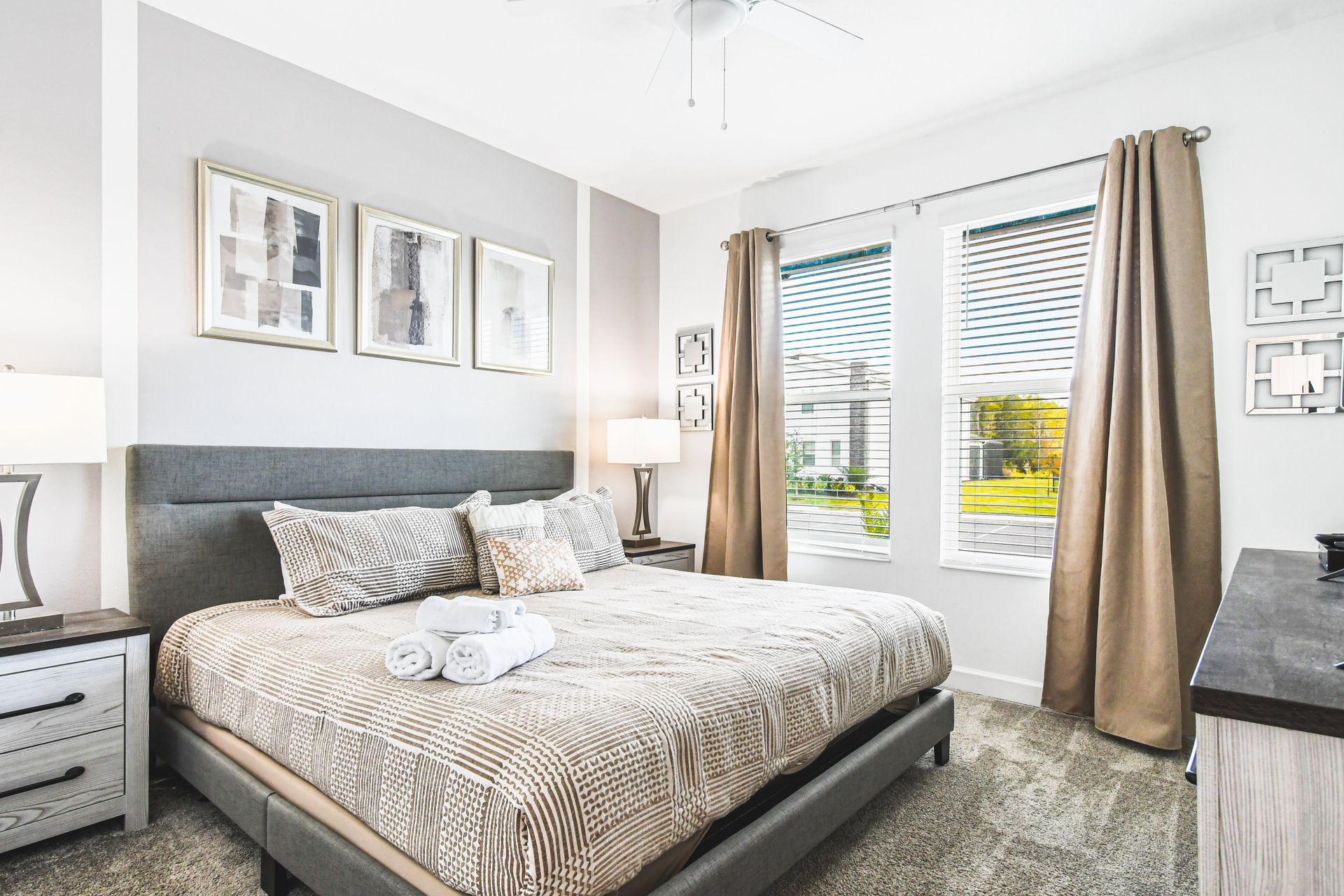 Tranquil bedroom with natural light, cozy linens, and a sleek modern design