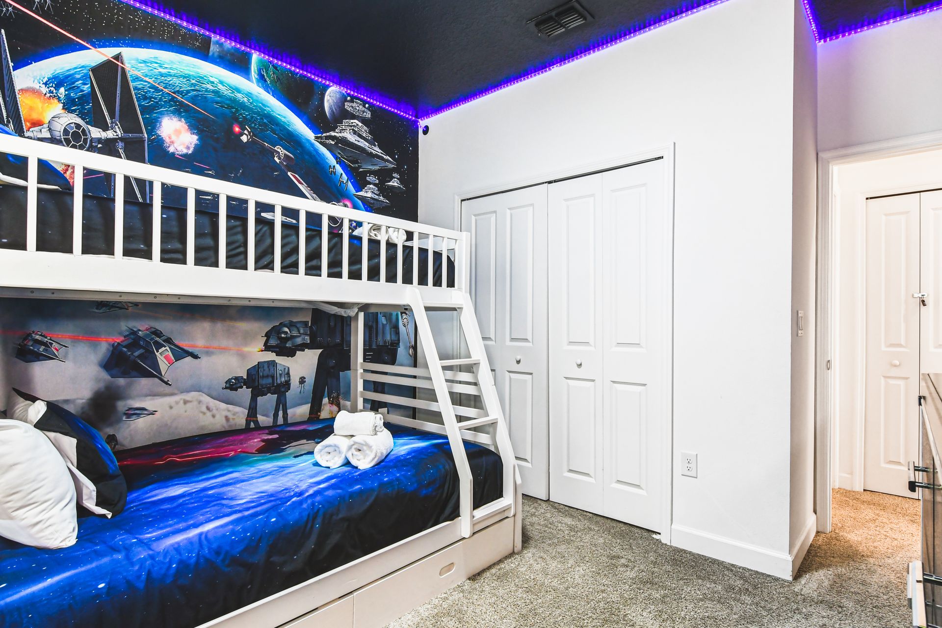 Galactic bunk room with LED lights and epic space battle murals for young explorers