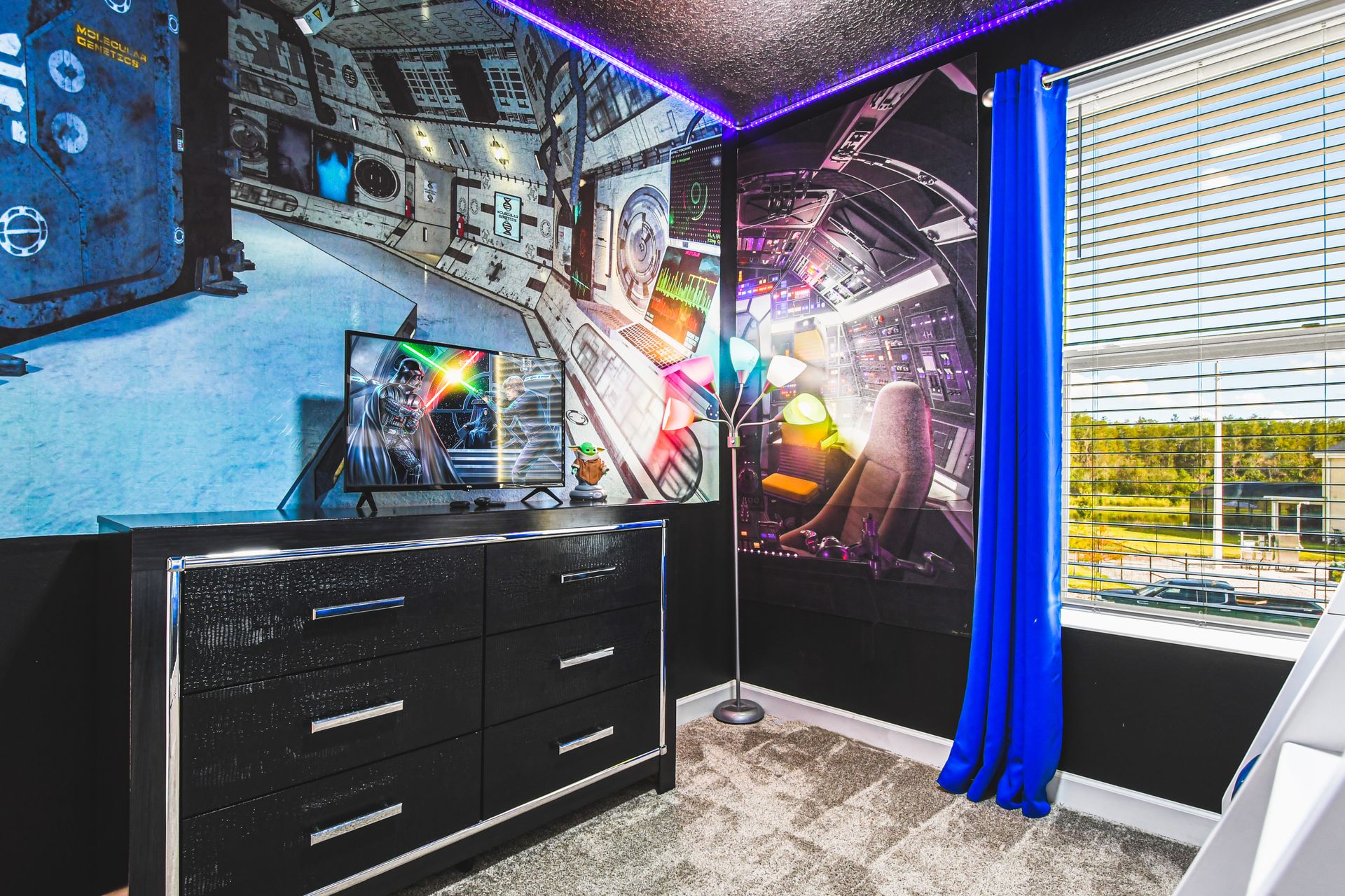 Immersive space-themed room with epic wall art, LED lights, and adventure vibes