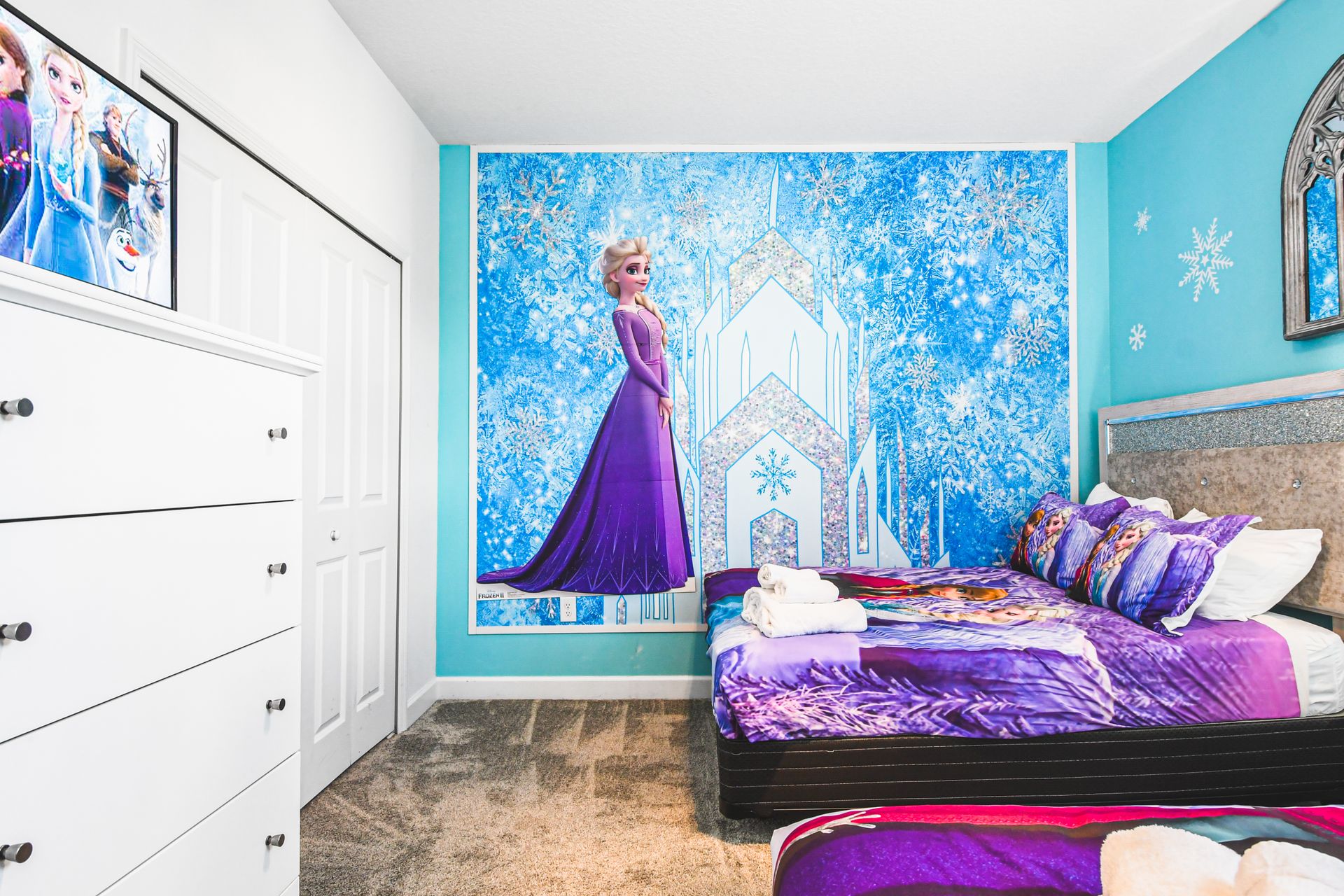 Whimsical ice princess room with sparkling decor, perfect for Frozen-themed fun