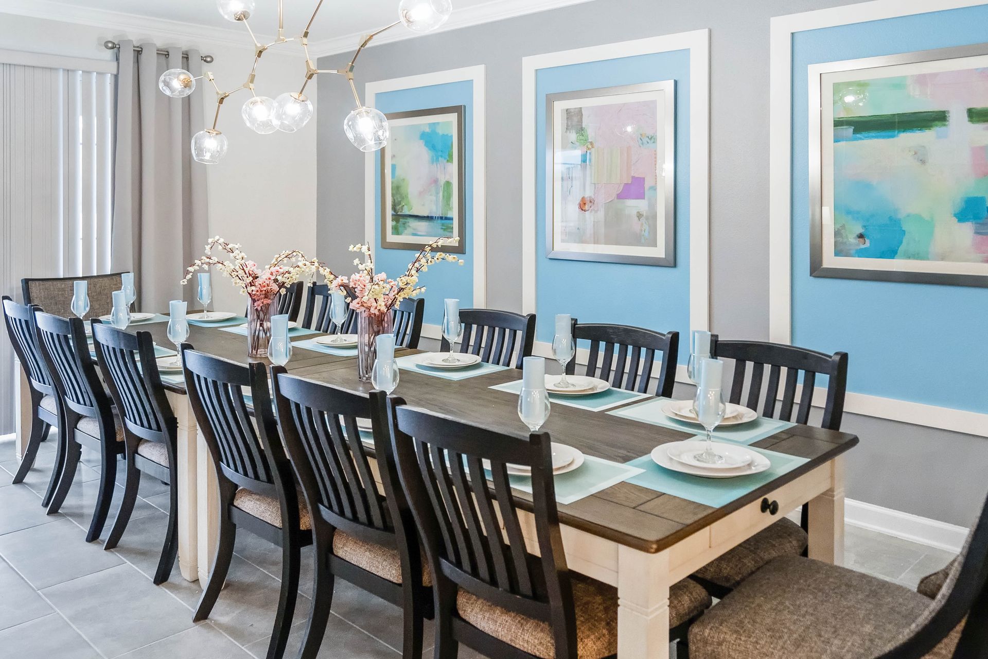 Spacious dining area with elegant seating for 12, stylish decor, and poolside views.
