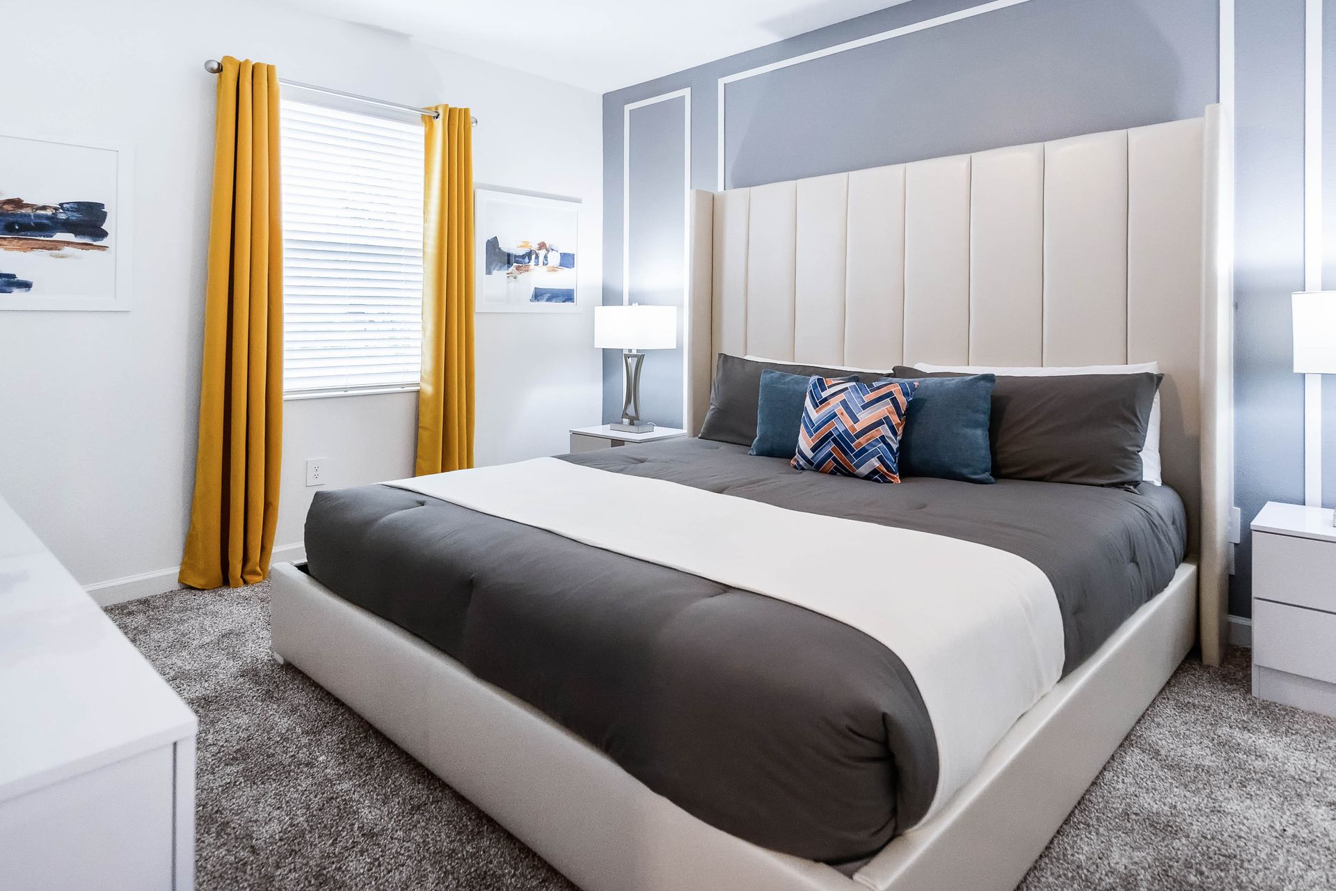 Elegant and serene bedroom featuring a modern tufted headboard.