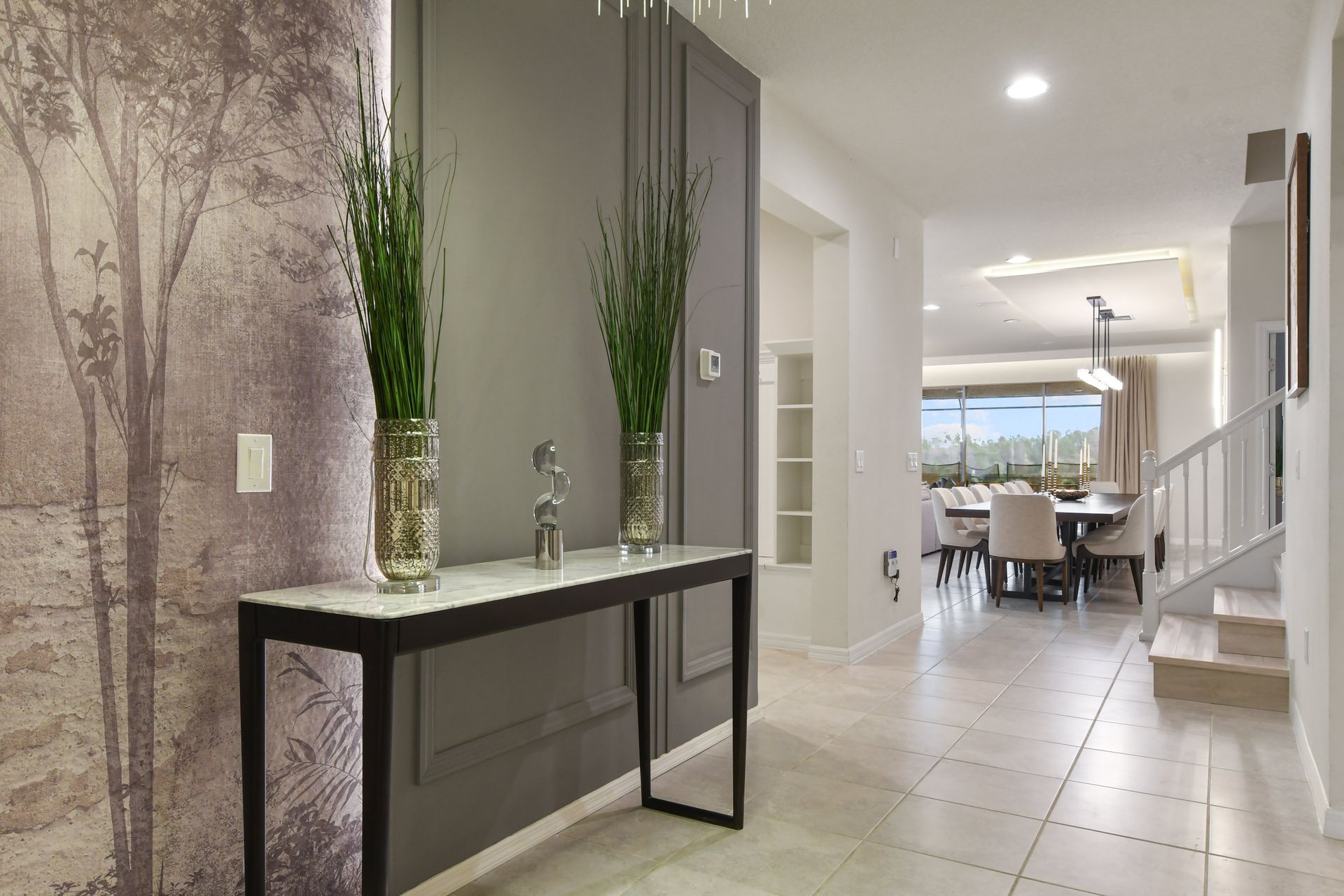 Stylish entryway welcomes you to a modern, elegant home with stunning details!