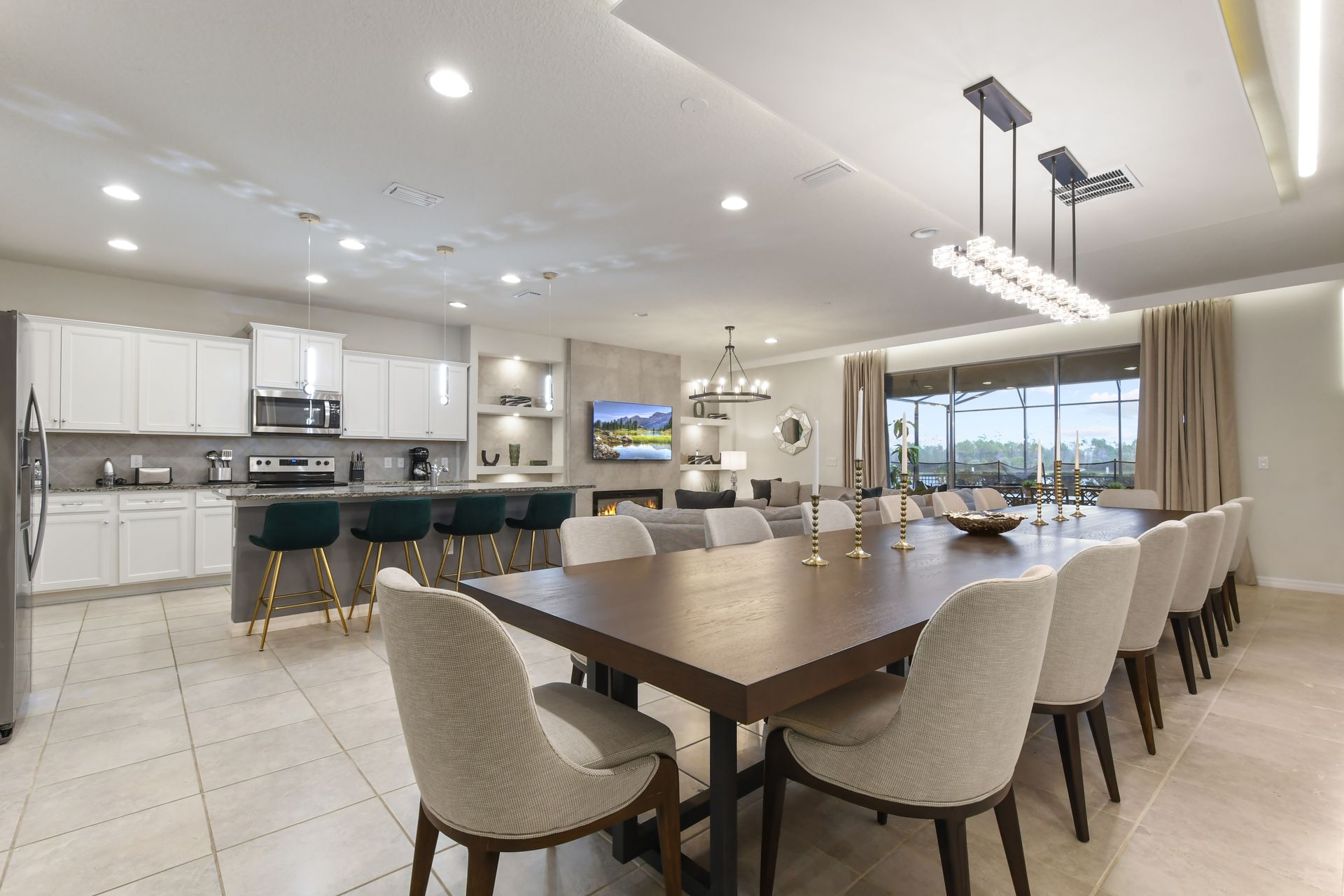 Expansive open-plan space with a modern kitchen, dining area, and cozy living room.