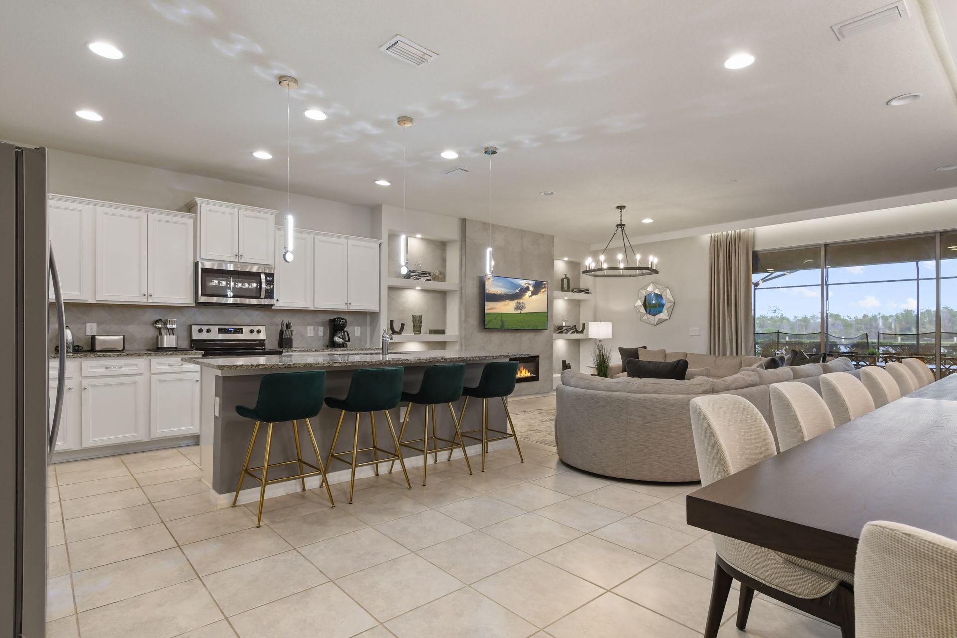 Stunning open-concept home with a sleek kitchen, cozy fireplace & lake views!