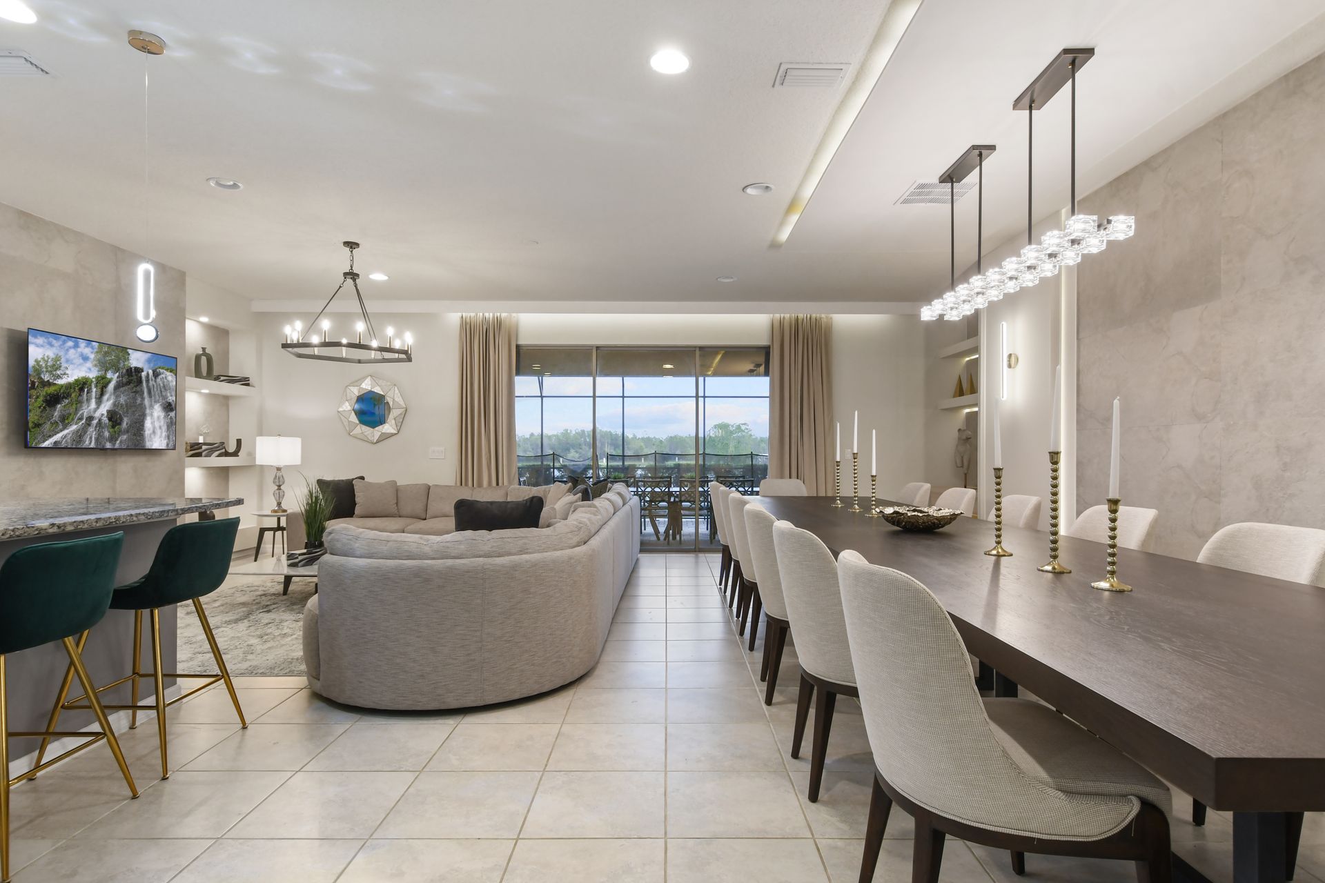 Contemporary living and dining area with sleek décor, cozy seating, and outdoor views.