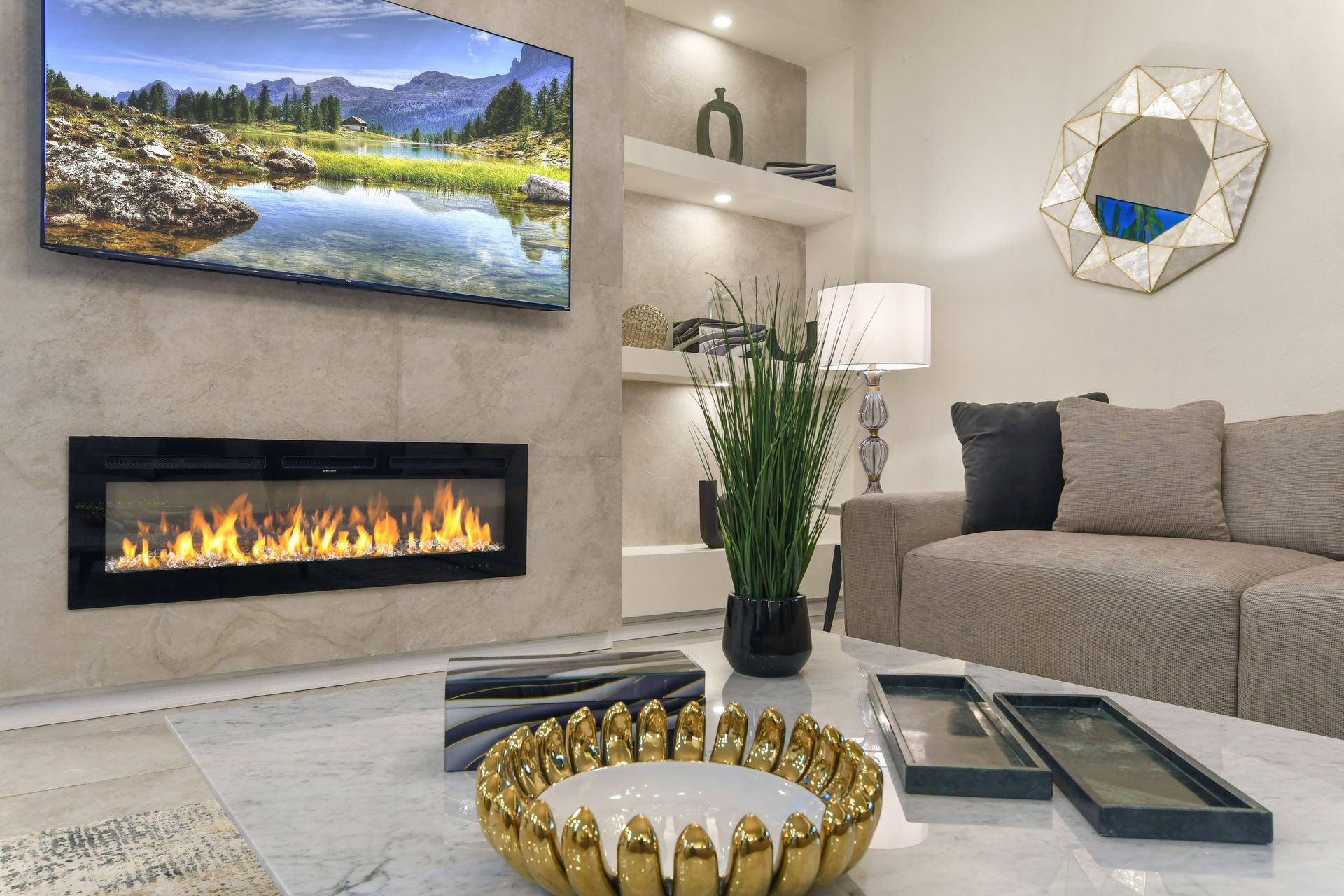 Chic & cozy living space with a fireplace, luxe décor, and serene lake views!