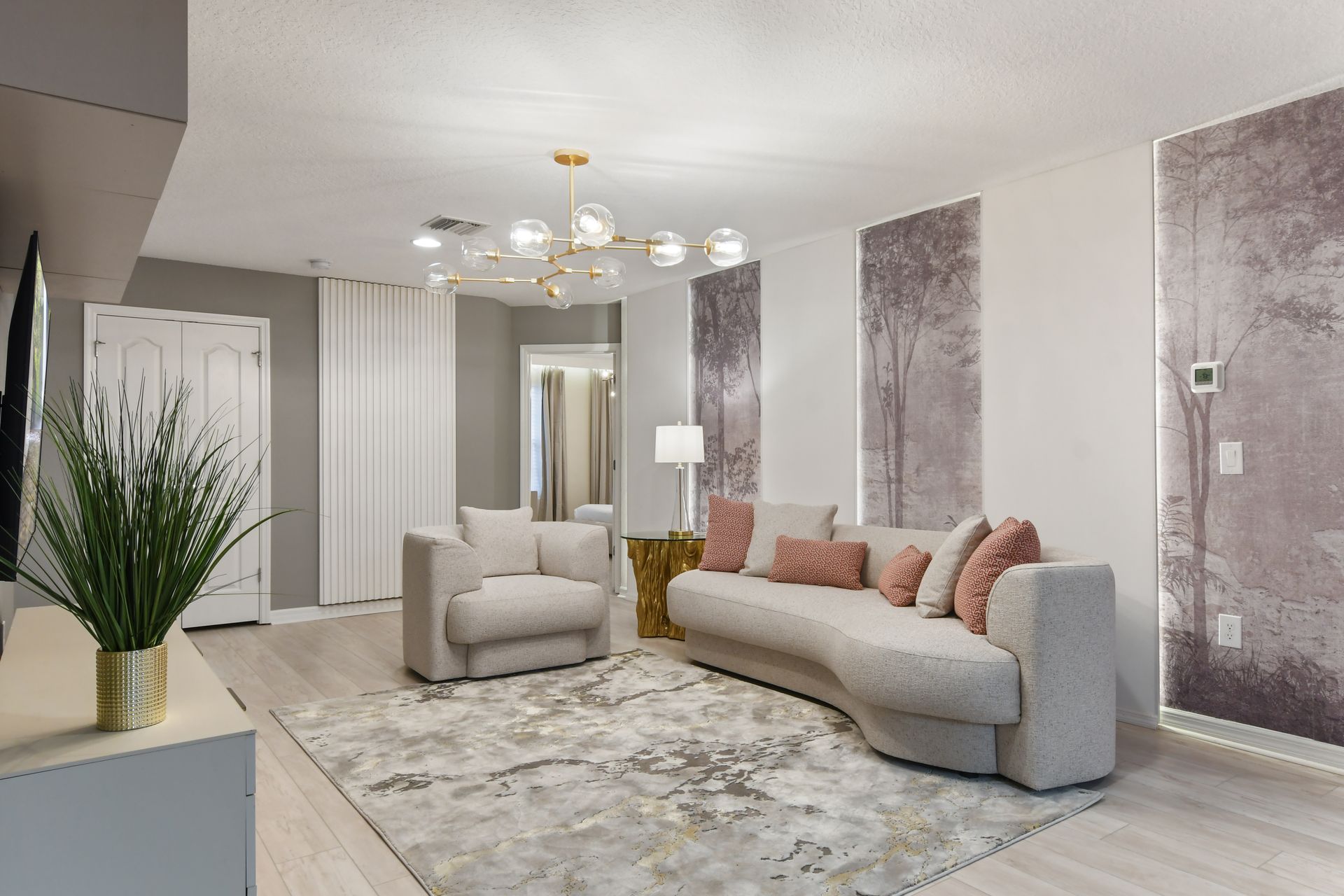 Elegant lounge with modern design, cozy seating & chic gold accents! 