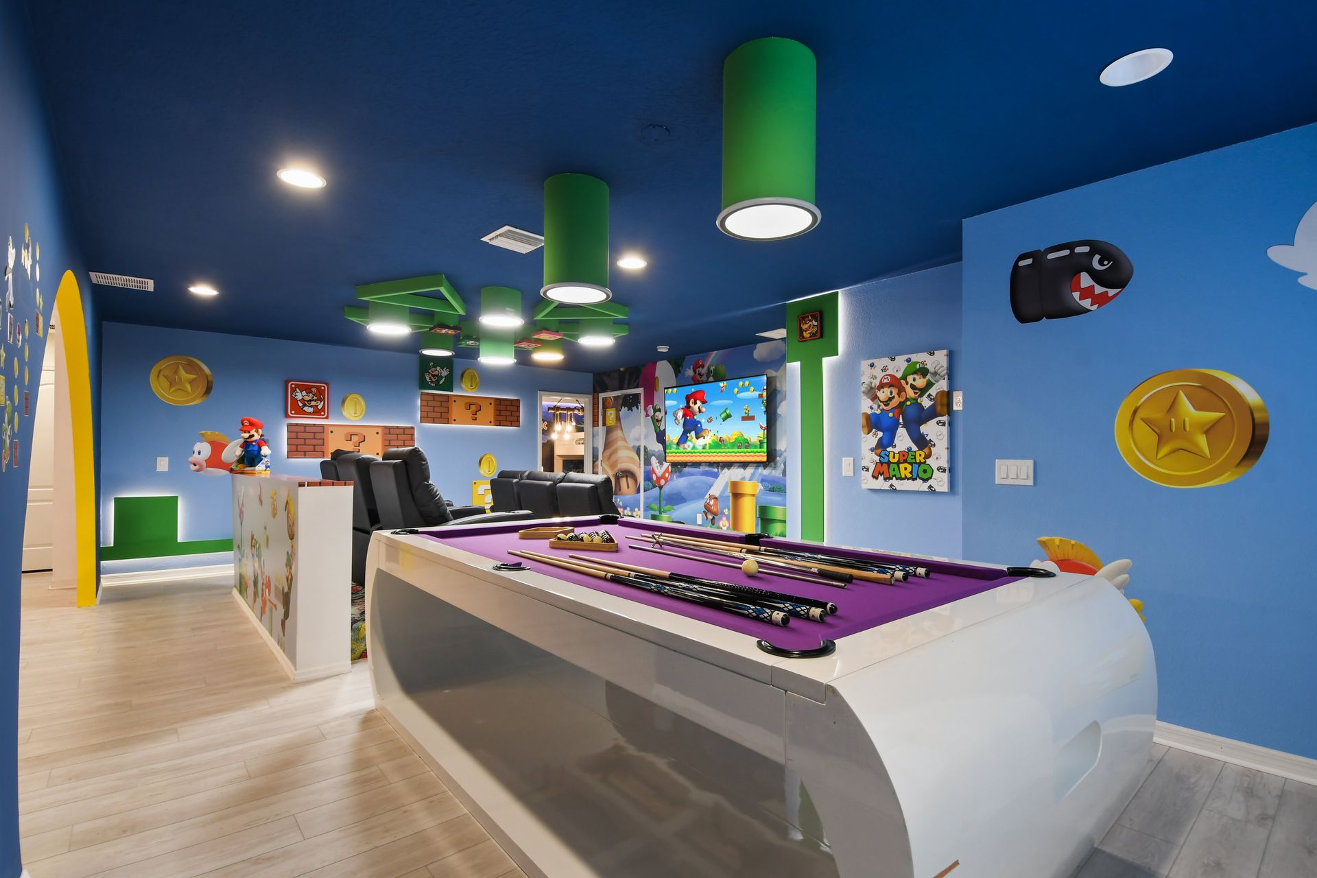 Epic Super Mario game room with pool table, theater seating & arcade fun!