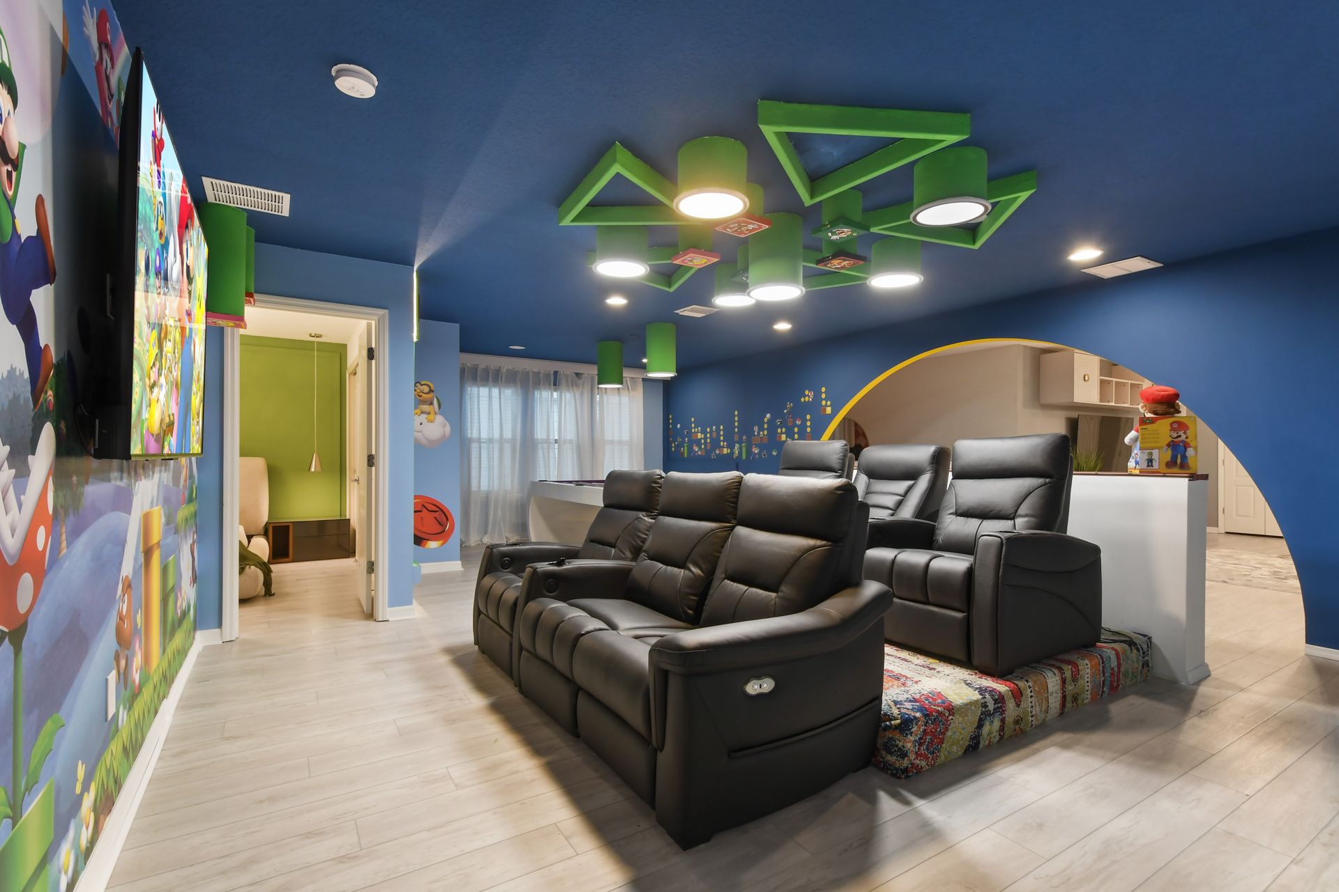 Super Mario-themed theater with comfy recliners & gaming fun!