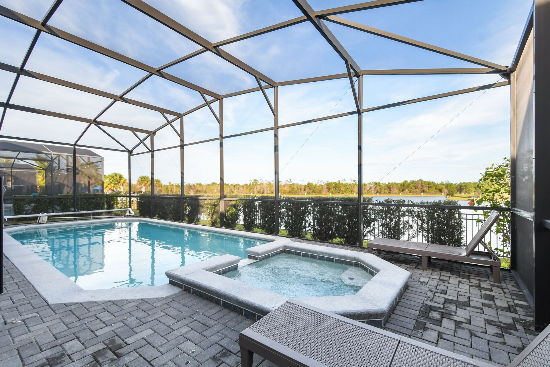 Private screened-in pool & spa with lush surroundings—your perfect getaway oasis!