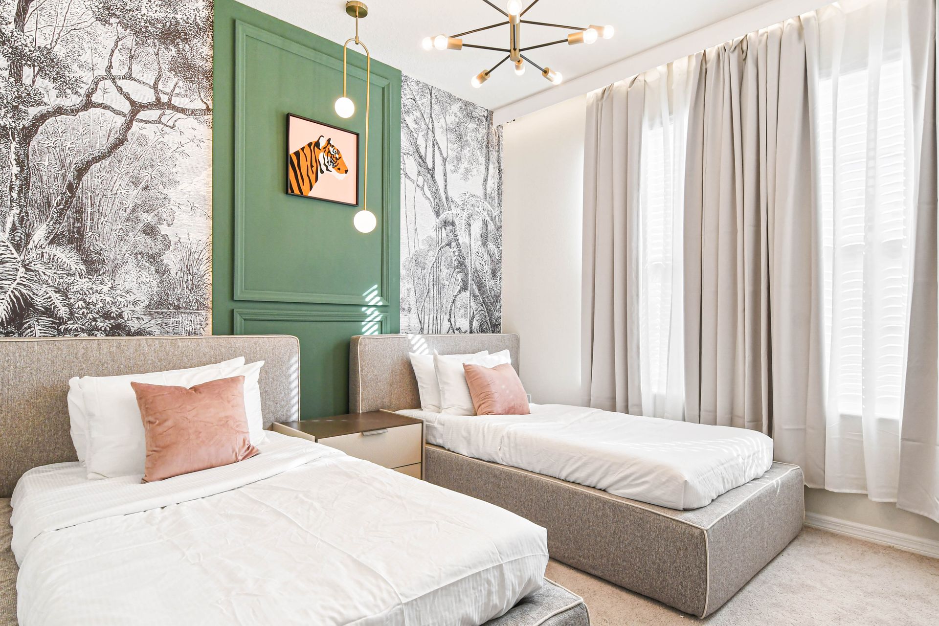 Chic twin bedroom with jungle mural, modern lighting, and soft neutral tones