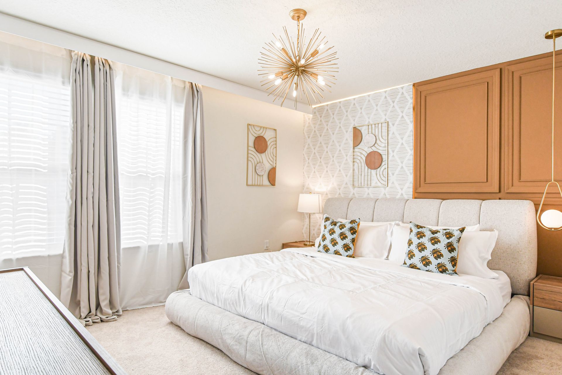 Chic king suite with mid-century flair, designer lighting, and natural textures