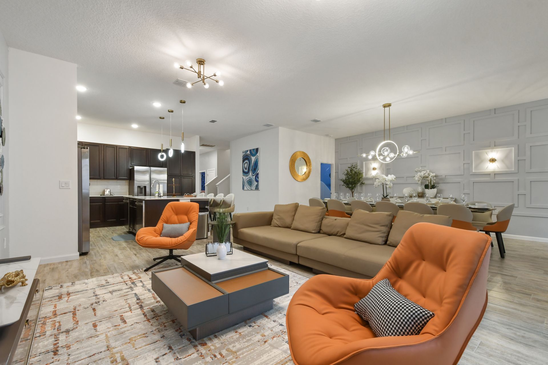 Modern open-concept living space with stylish decor, plush seating, and elegant dining.