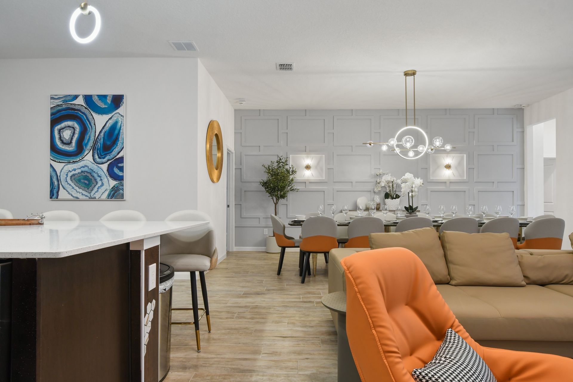 Sophisticated dining room with elegant table settings, modern decor, and stylish lighting.