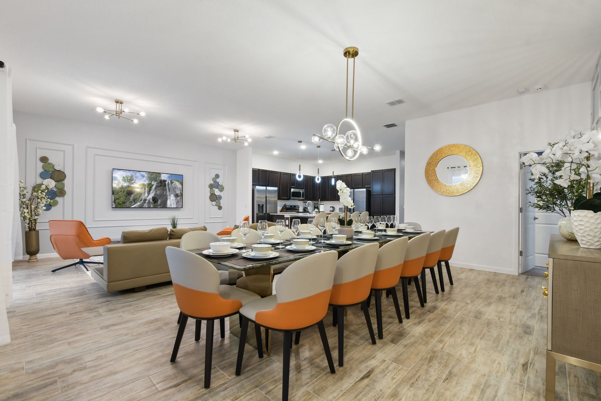 Luxury open-concept dining and living space with modern decor and elegant lighting.