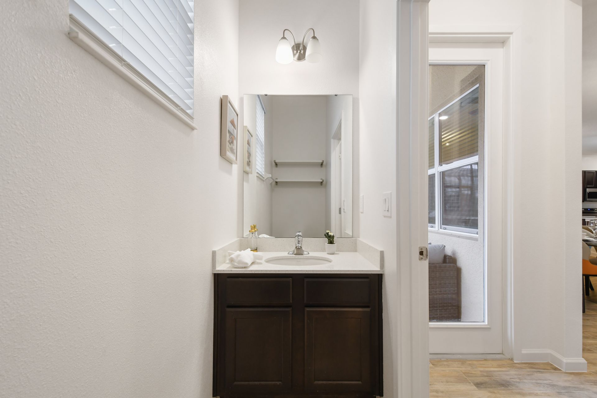 Modern bathroom with sleek vanity, bright lighting & a refreshing walk-in shower!