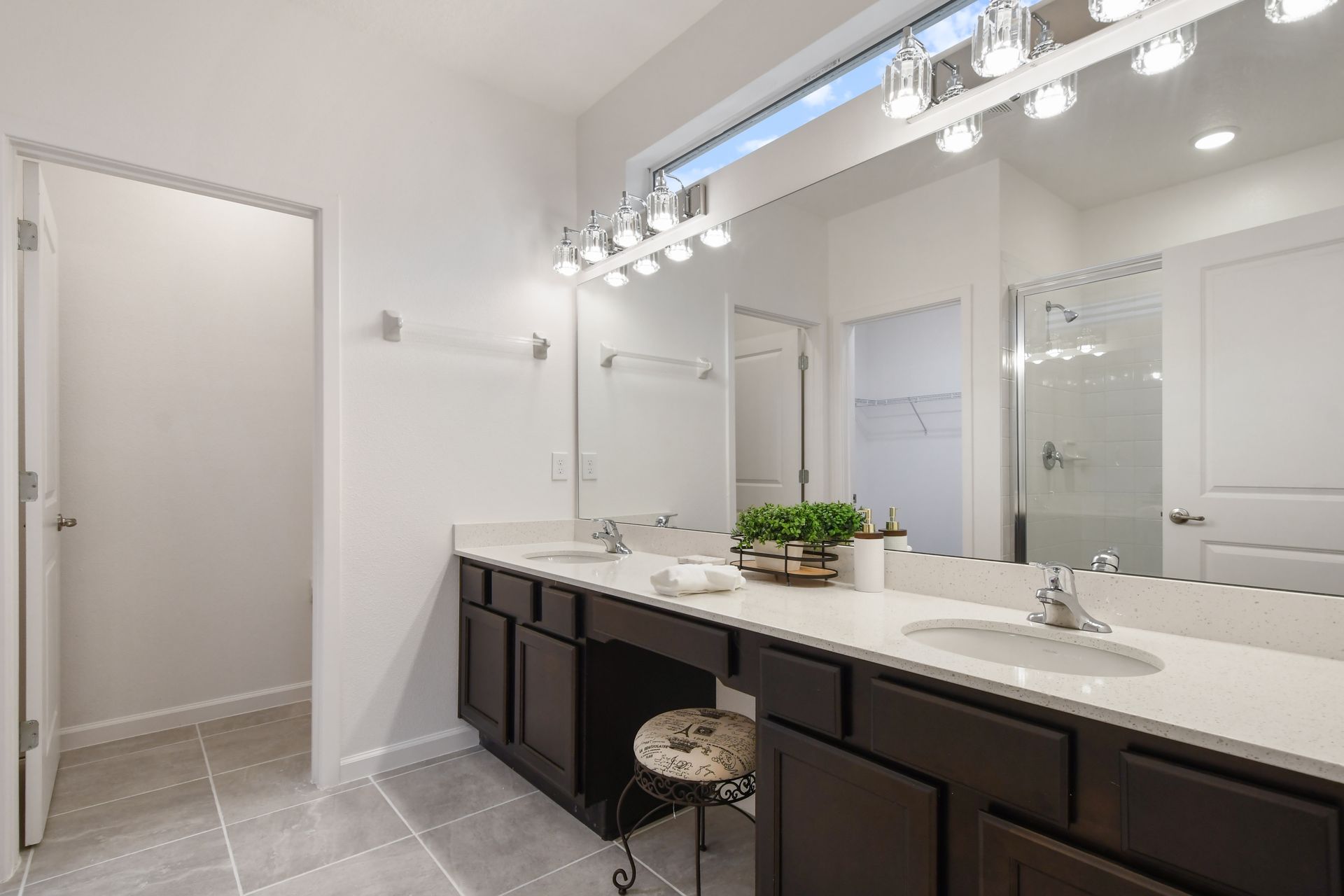 Spacious spa-like bathroom w/ double vanity, walk-in shower & modern finishes!
