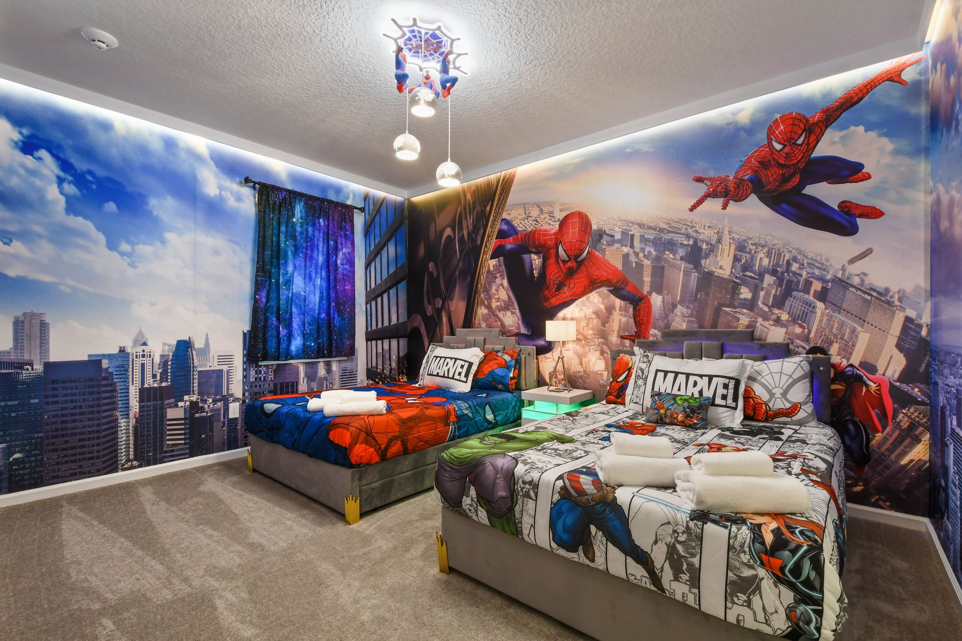 Superhero-themed bedroom with bold wall art, cozy twin beds, and immersive city views.