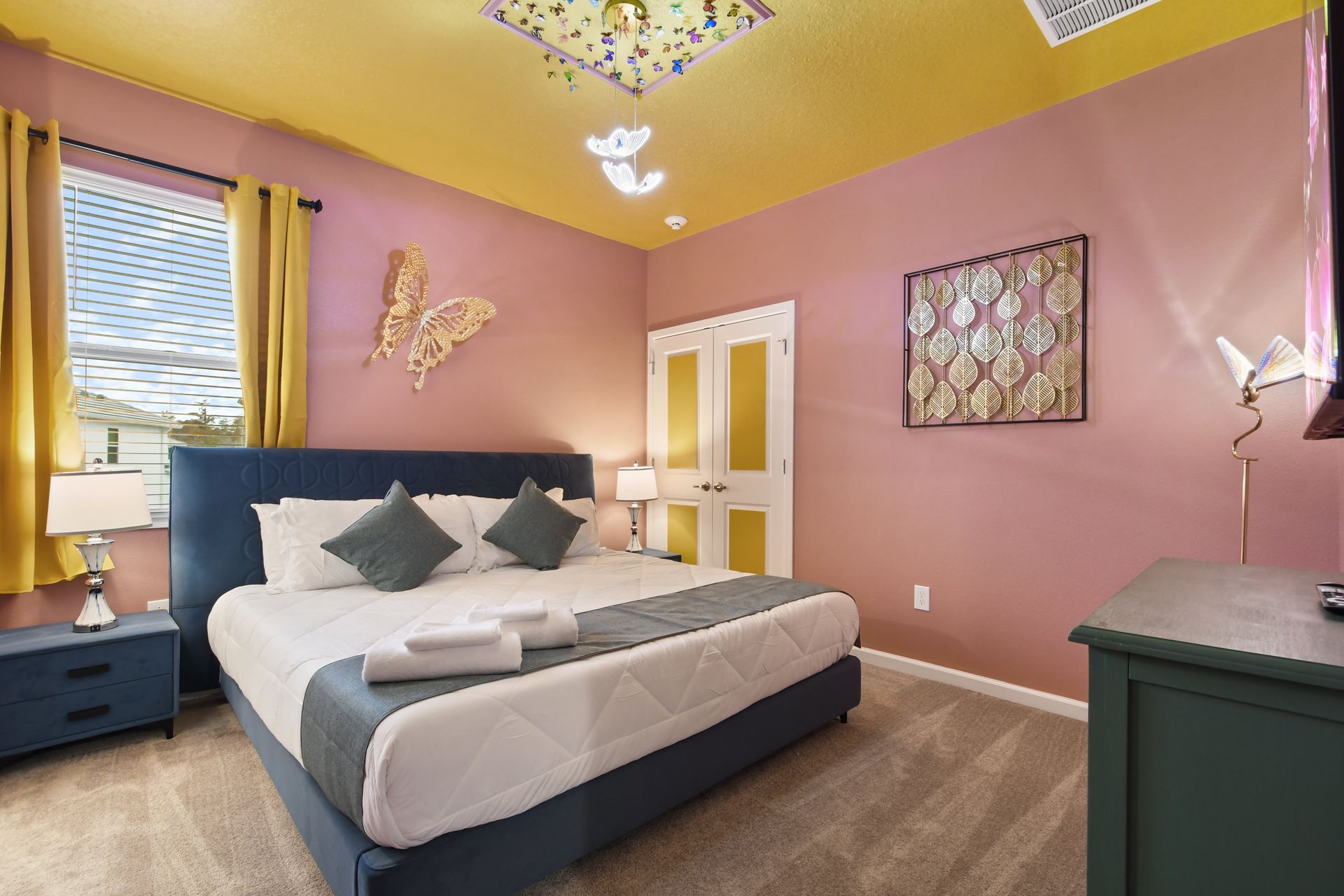 Vibrant nature-inspired bedroom with butterfly accents, bold colors, and cozy decor.