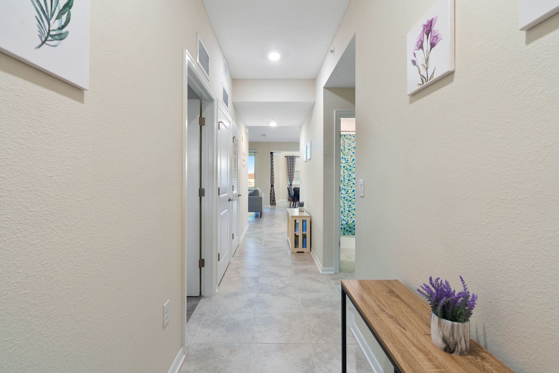 Welcoming house hallway, adorned with tasteful decor and providing a seamless connection between different living spaces
