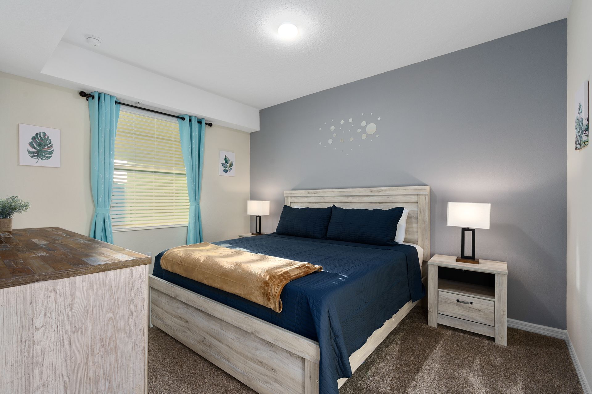 Inviting king-sized bedroom designed for coziness, offering a warm and comfortable space for a restful night's sleep