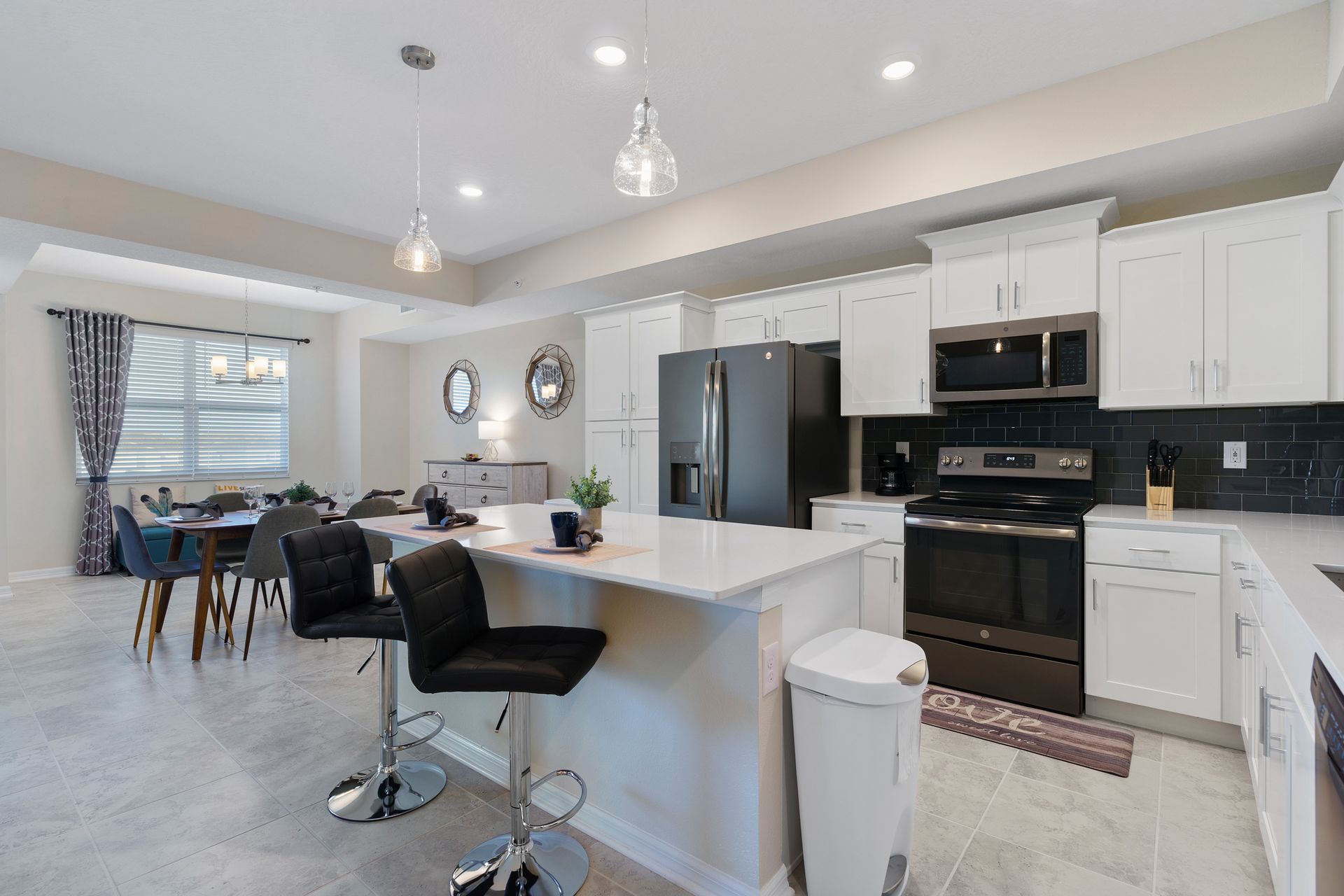 Kitchen featuring a convenient breakfast bar, offering a stylish and casual dining space for quick meals or socializing while preparing food