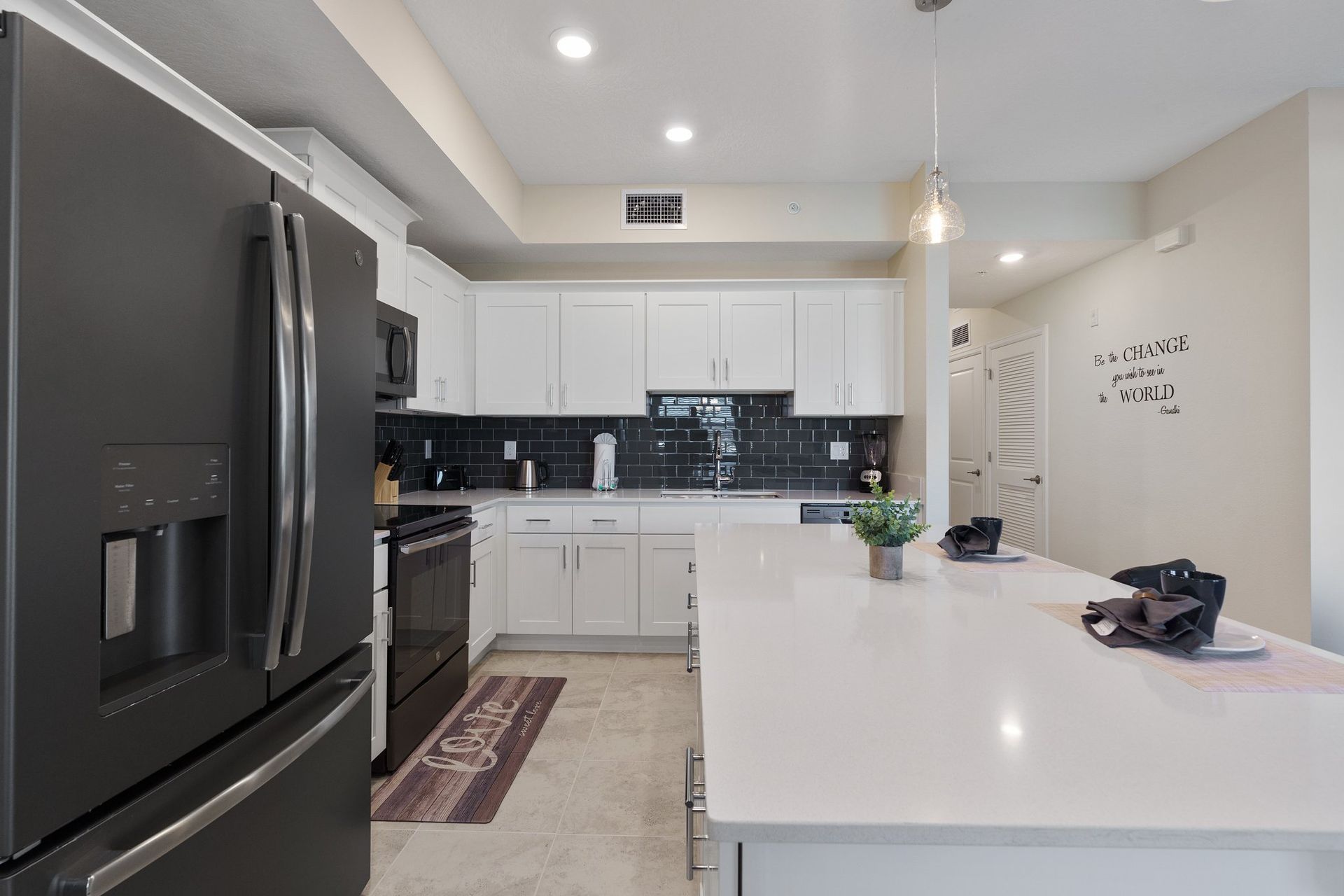 Kitchen featuring a convenient breakfast bar, offering a stylish and casual dining space for quick meals or socializing while preparing food