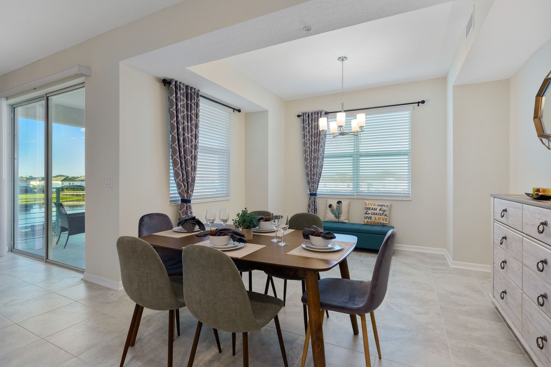 pacious dining area equipped with a 6-seater table, providing an ample and stylish setting for large gatherings.