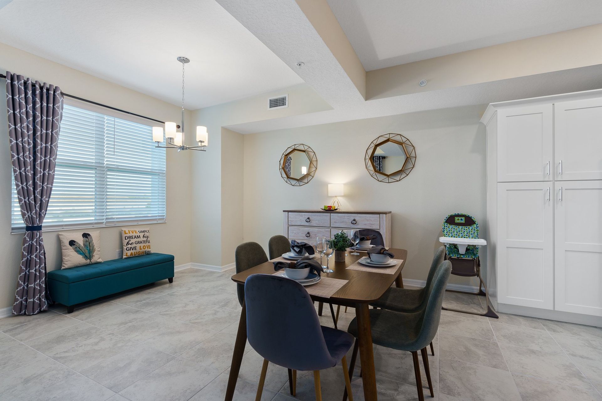 pacious dining area equipped with a 6-seater table, providing an ample and stylish setting for large gatherings.