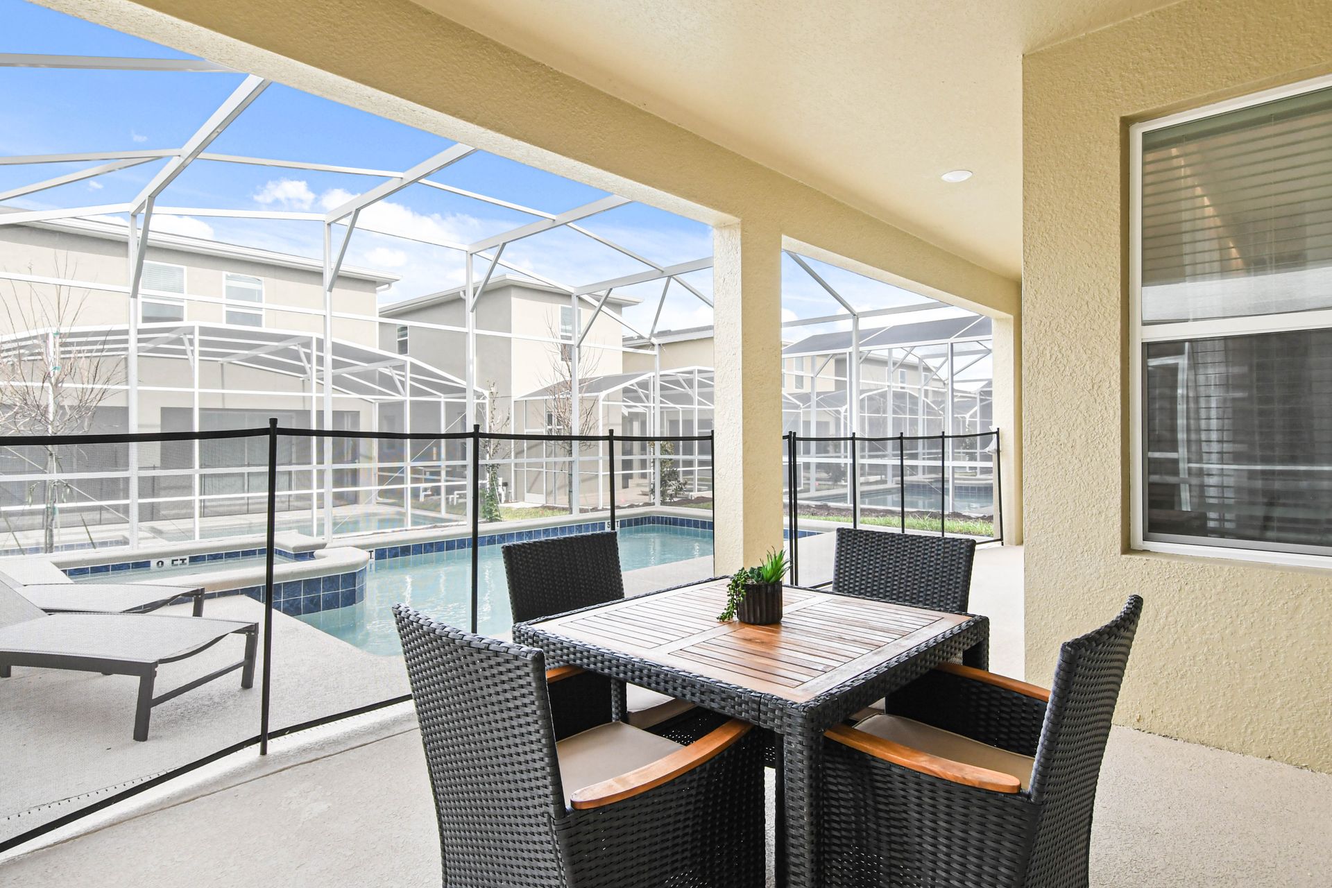 The outdoor pool area is a luxurious retreat for relaxation and entertainment. It features a large, heated swimming pool.