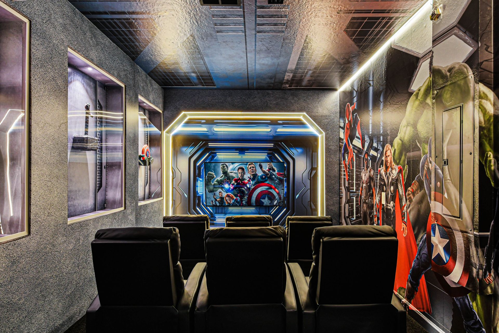 The cinema room is designed for the ultimate movie-watching experience. It boasts a large projector screen, creating an immersive audio-visual environment.
