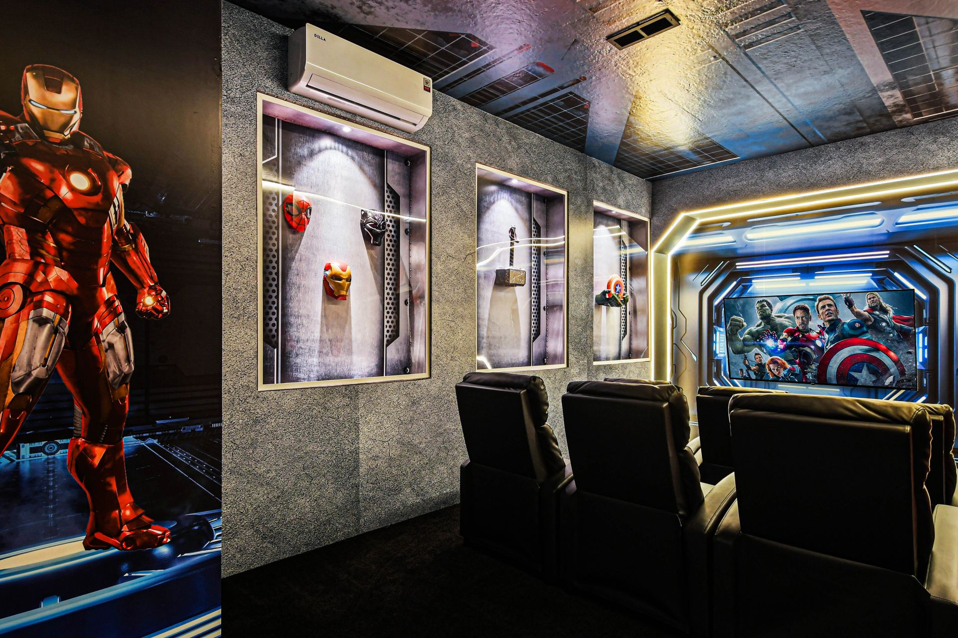 Epic superhero-themed home theater with luxury recliners and immersive Marvel décor.