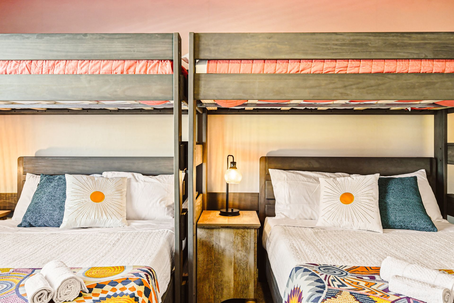 Two bunk beds with a full bed on the bottom and a twin bed on top, providing ample sleeping space.