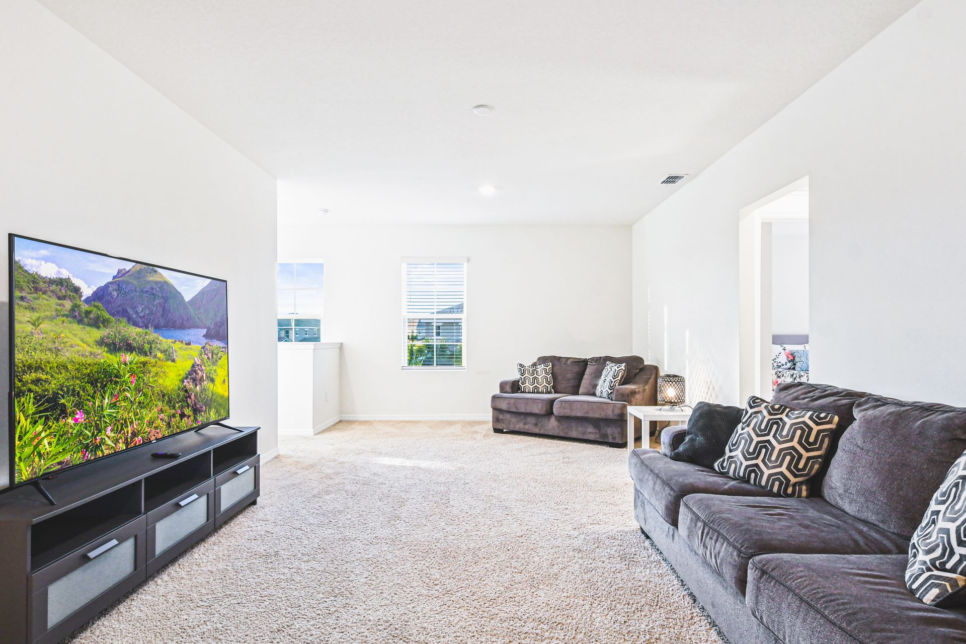 Enjoy quality time with loved ones in our inviting second floor living room, offering a cozy space for relaxation.